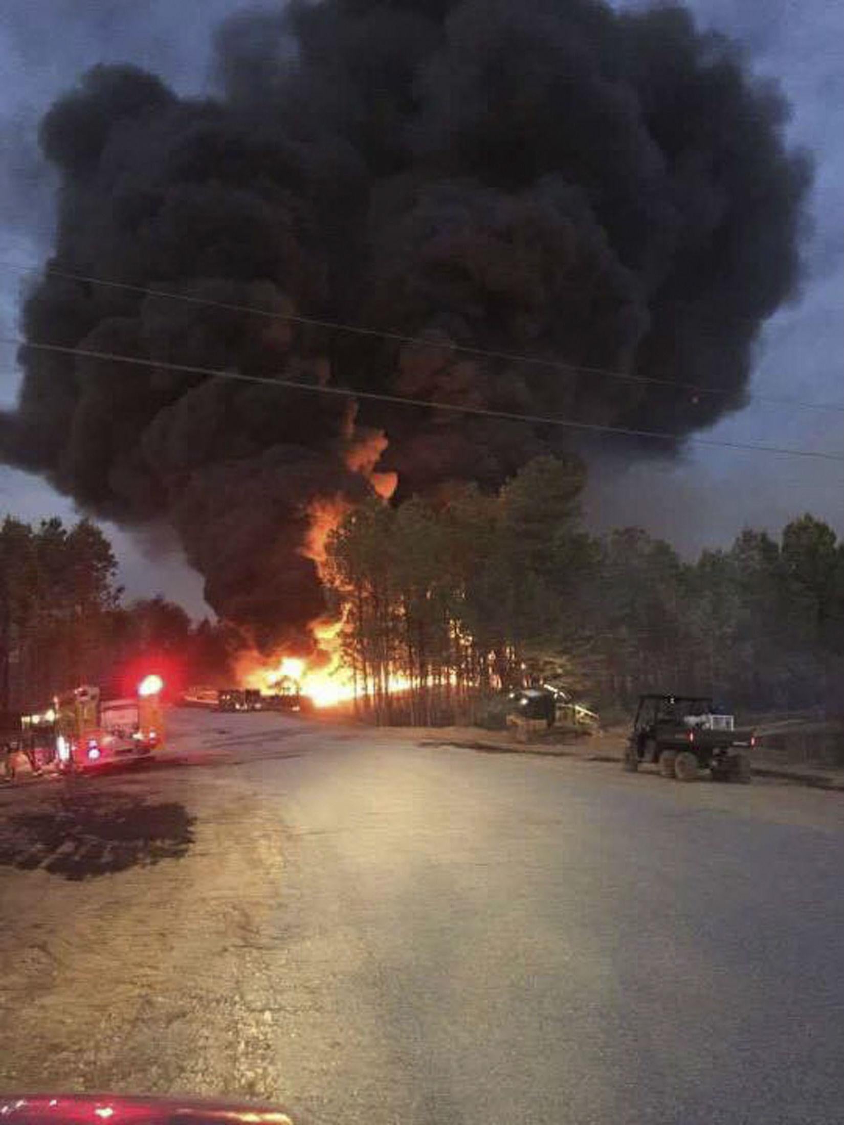 Emergency teams arriving at scene of pipeline explosion