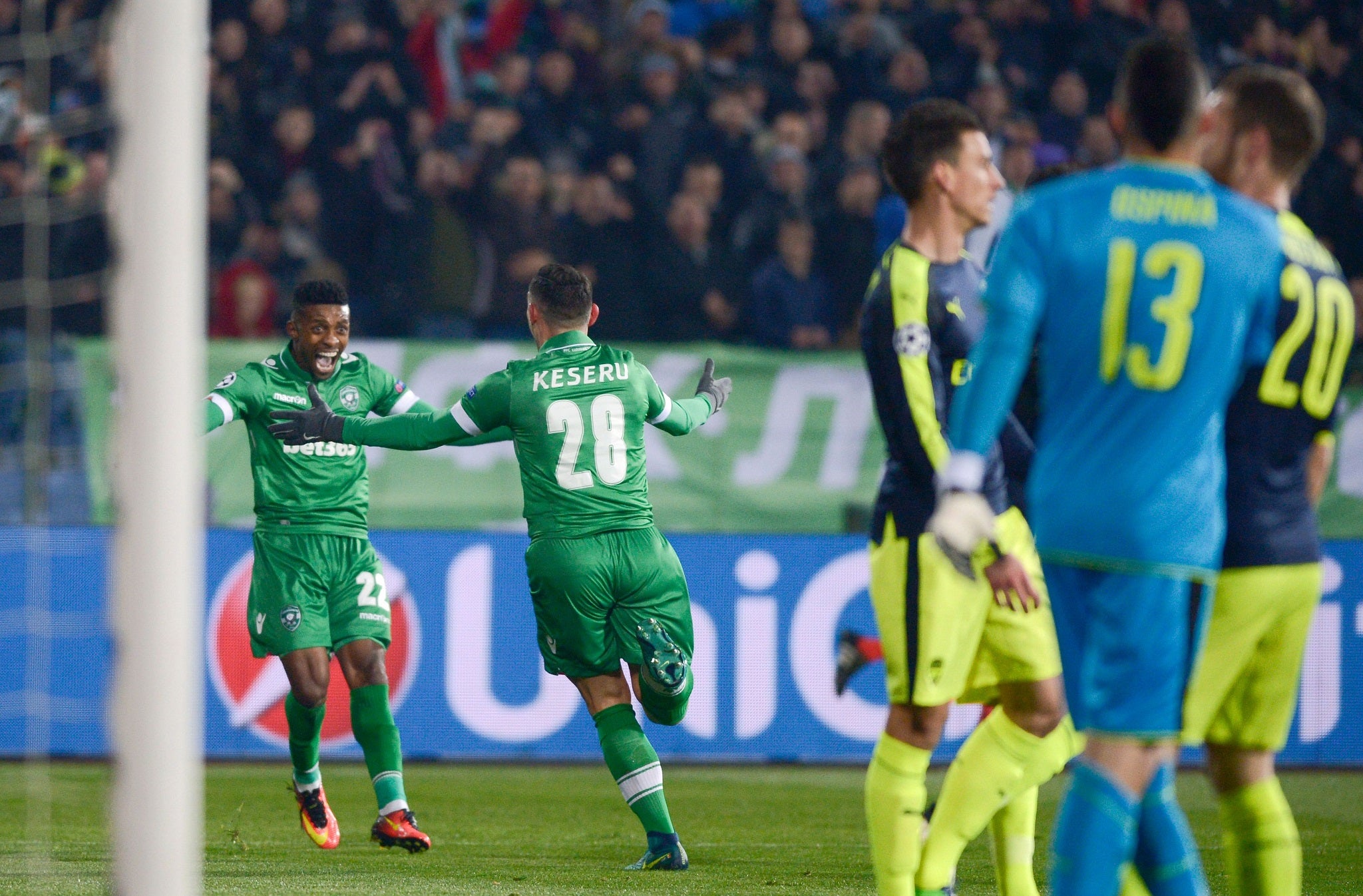 Claudiu Keseru runs towards Jonathan Cafu after tapping home his cross to score Ludogorets's second goal