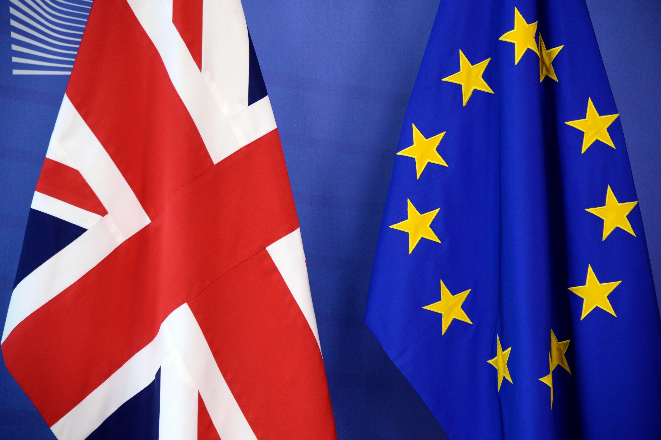 The British flag and the European Union flag are displayed at the European Union Commission headquarters in Brussels