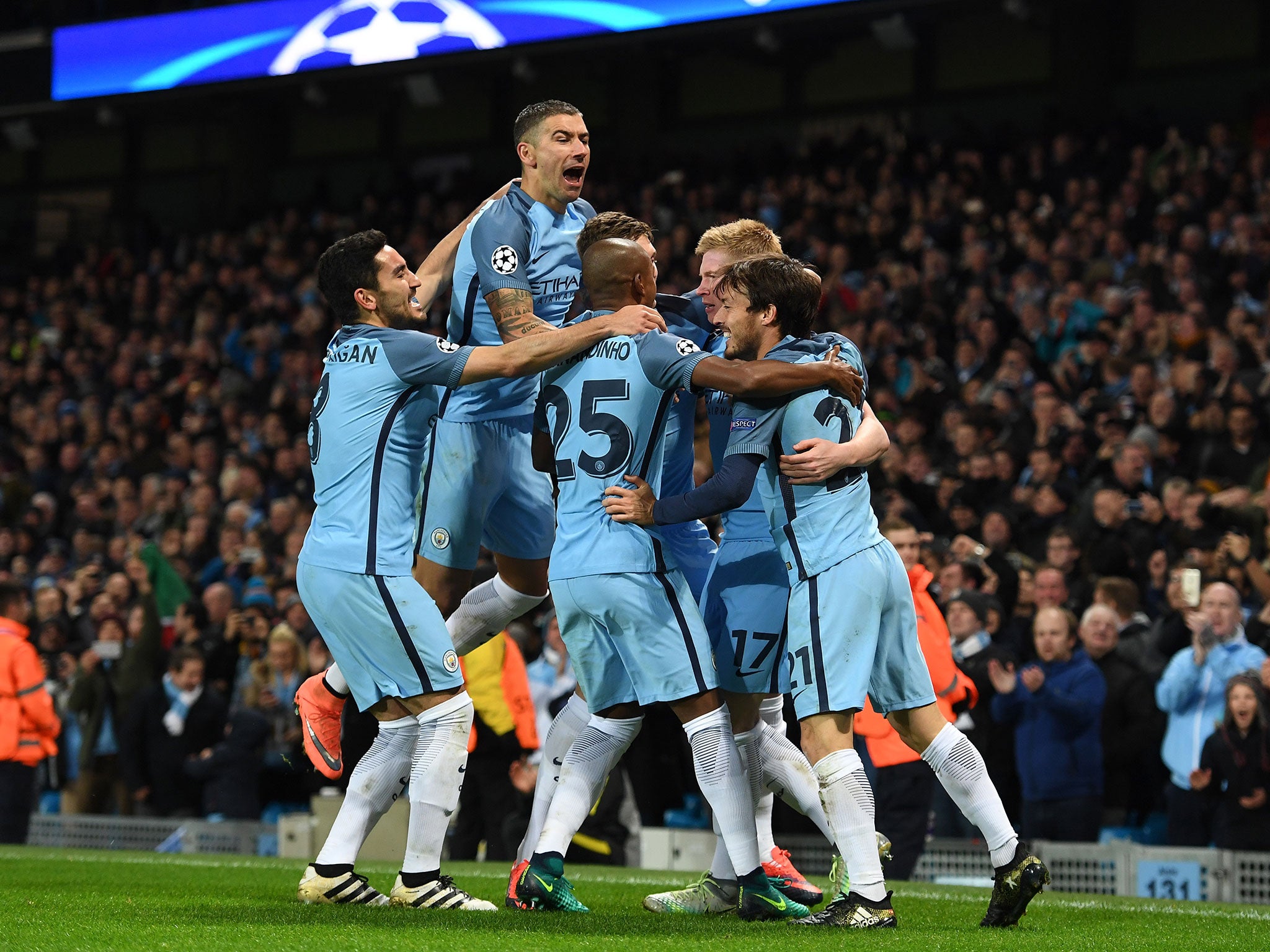 Manchester City players celebrate with Kevin de Bruyne after the Belgian put the home side ahead against Barcelona