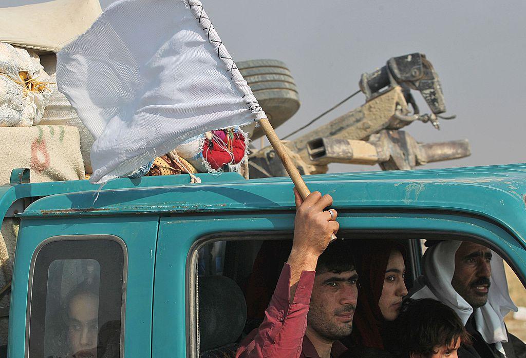 A family flees Mosul as the US-backed offensive to regain the City enters its fourth week