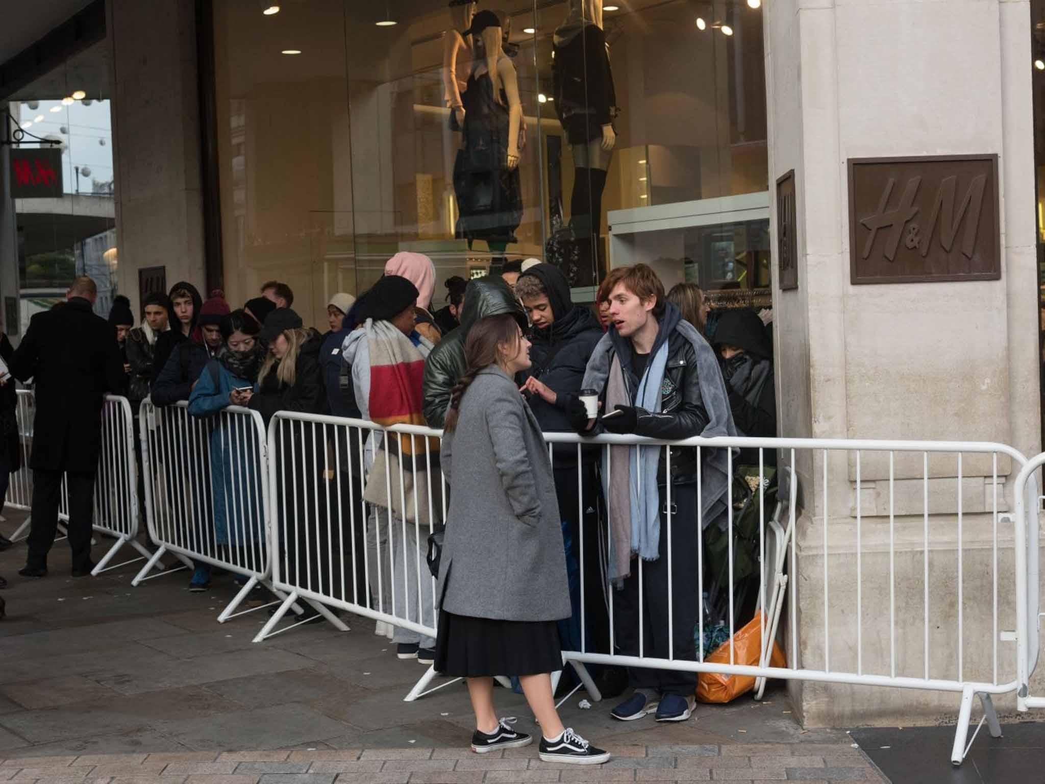 Customers queue overnight outside Oxford circus store (Ray Tang/REX)