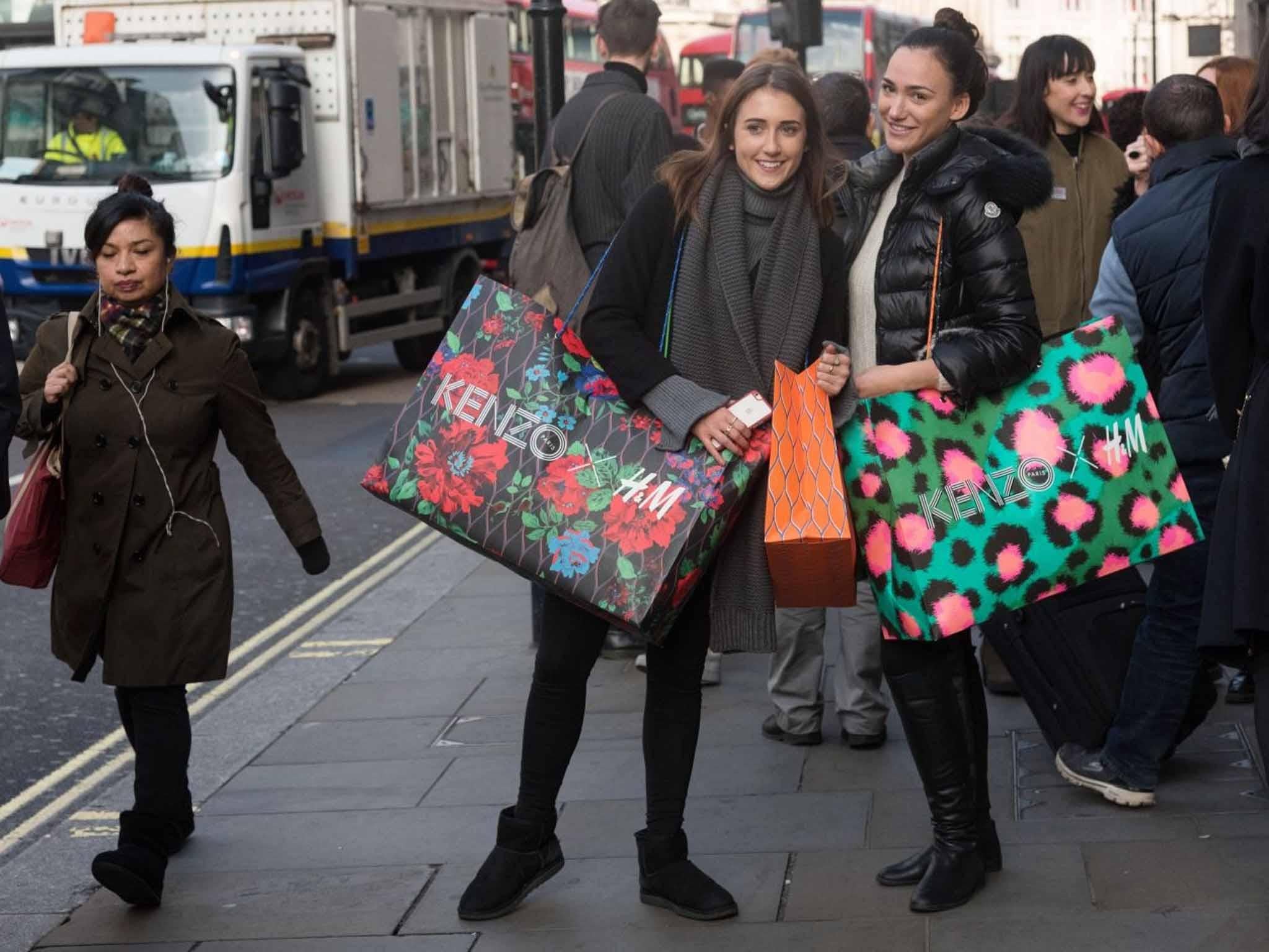 Customers leaving the Regent Street store (Ray Tang/REX)