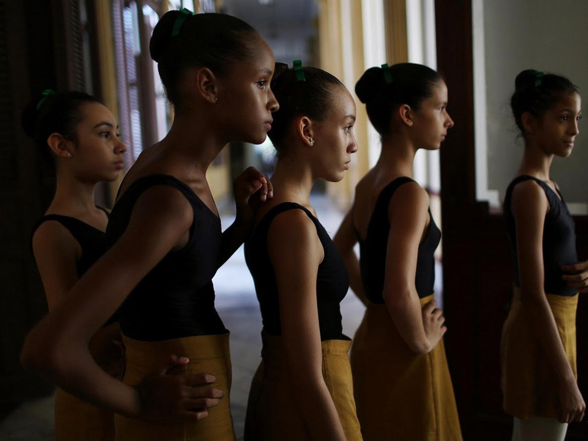 Students at the Cuba's National Ballet School (ENB) wait in line to enter a classroom in Havana, Cuba