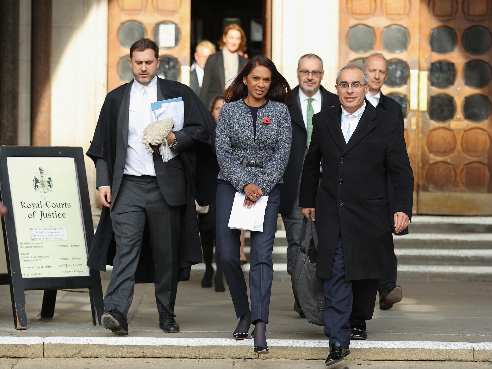 Lead claimant Gina Miller, pictured leaving the High Court with her team, has already been subjected to online racist abuse Getty