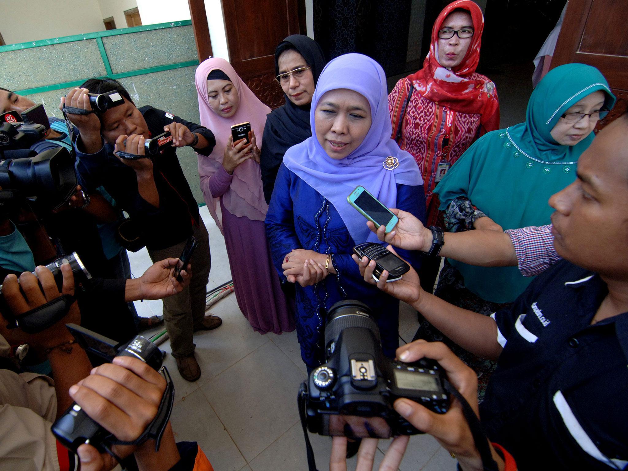 Indonesian social affairs minister Khofifah Indar Parawansa (C) talks to reporters at Al-Amien Islamic boarding school in Sumenep, Indonesia