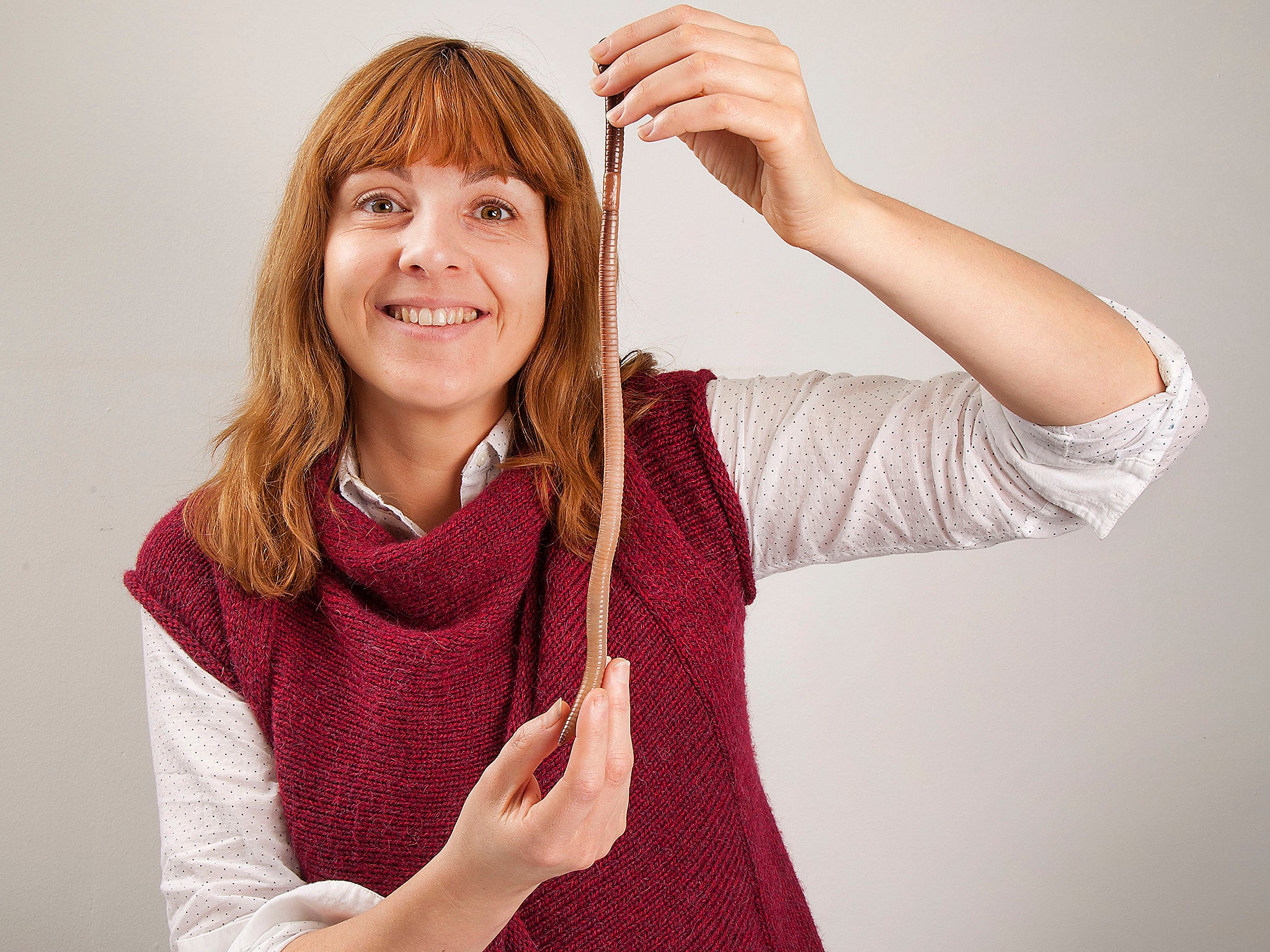 Emma Sherlock with Dave the earthworm, who has has wriggled his way into the record books after surfacing in Cheshire