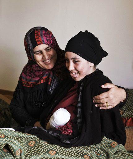 Fatima and her mother Nafla in their new home in Lebanon. Fatima lost both her hands at the age of 12 when an explosion hit the family home in Syria