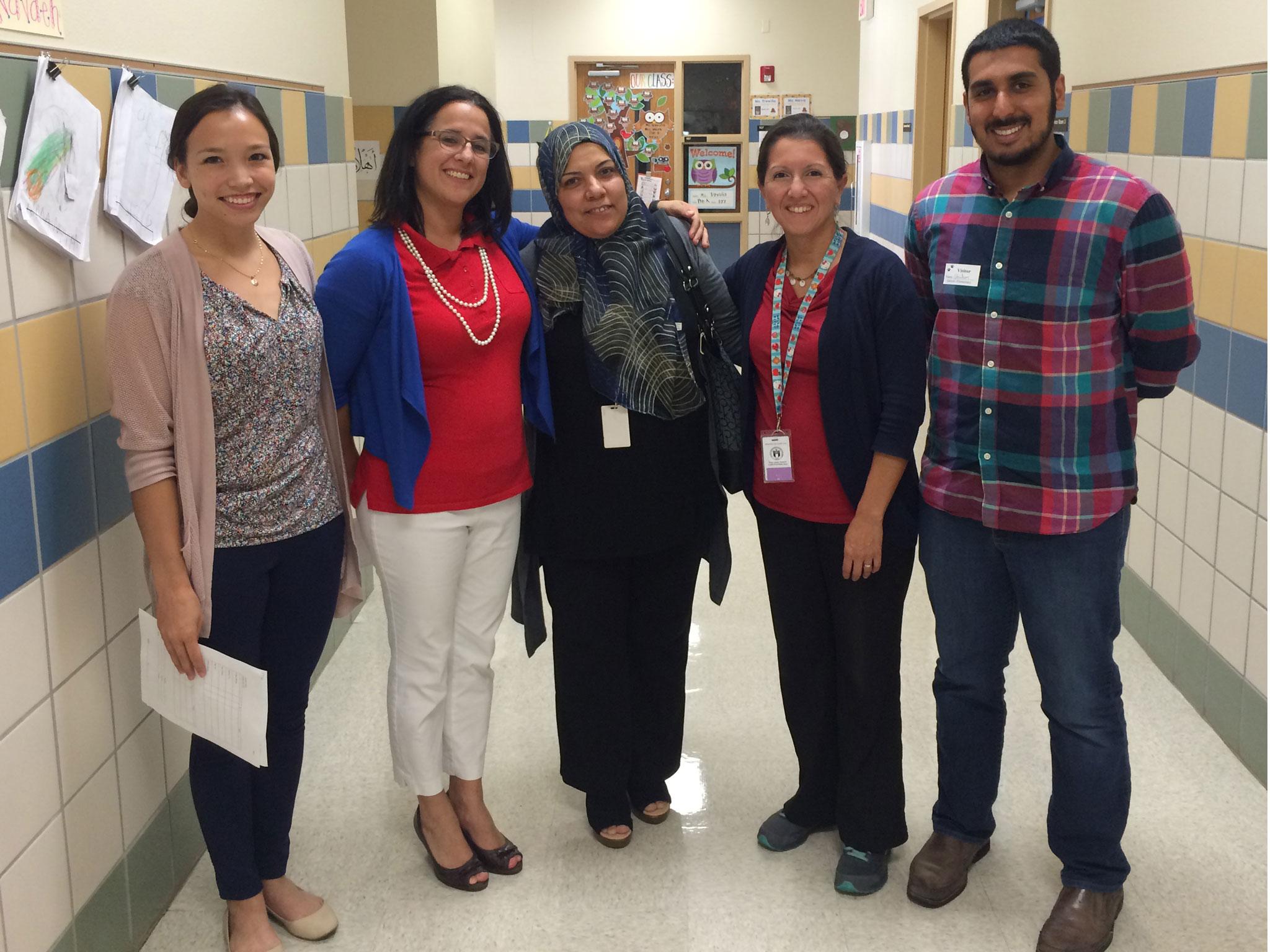 Michelle Browning, Principal Natascha Barreto-Romero, Emaan Abuissa, bilingual education coordinator Sandra Valle, and Ghulam Kehar