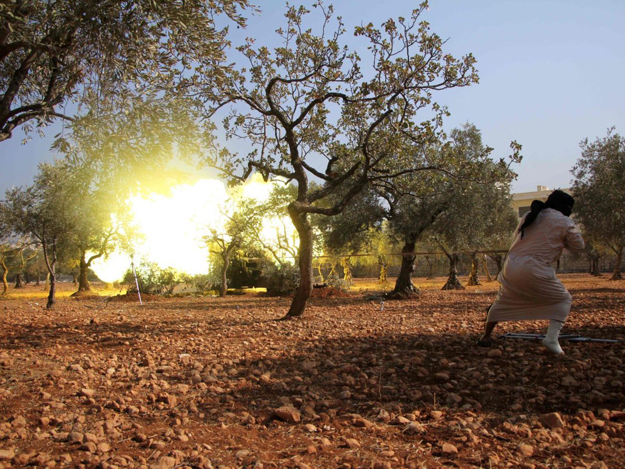 Rebel fighters from the Jaish al-Fatah brigade fire mortar shells towards government-controlled districts in Aleppo last week