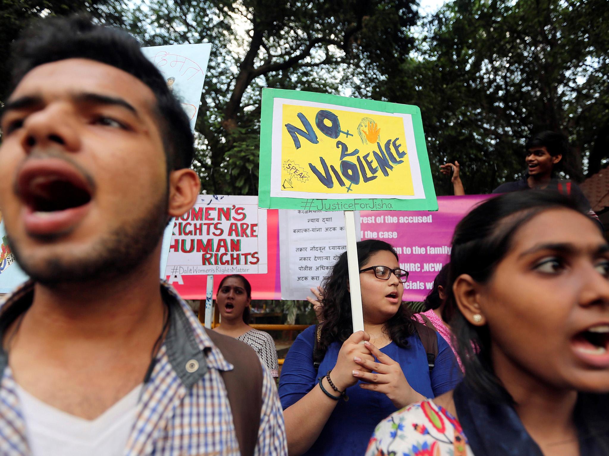 Demonstrators shout slogans during a protest against the rape and murder of a law student in the southern state of Kerala earlier this year
