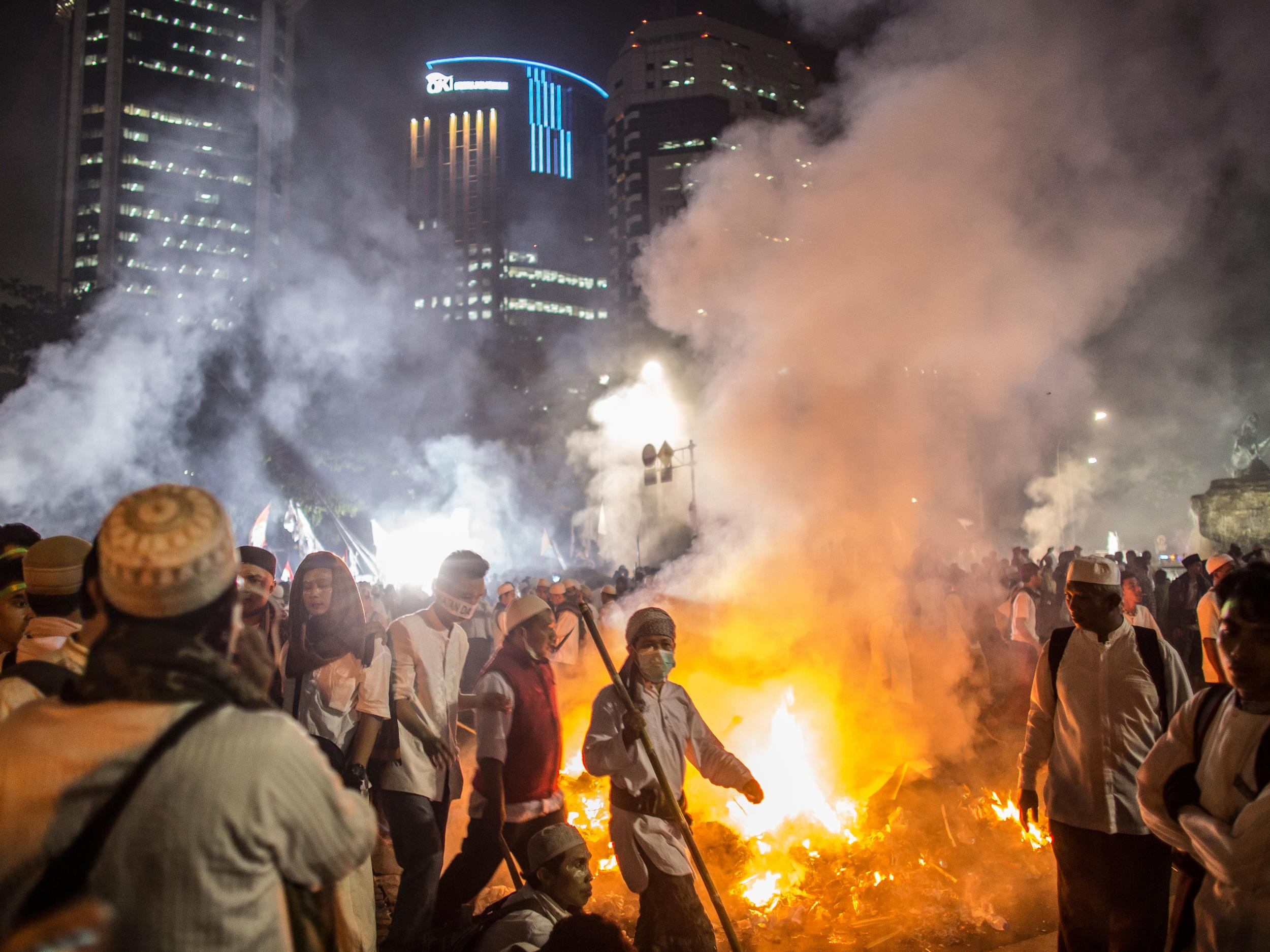 Islamic demonstrators march in Central Jakarta after a day of protest