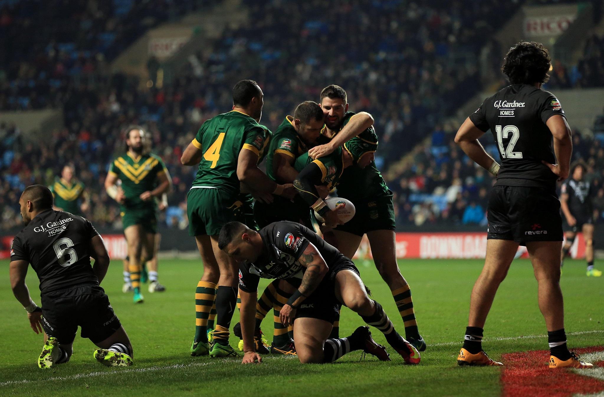 Jonathan Thurston celebrates scoring Australia's second try against New Zealand