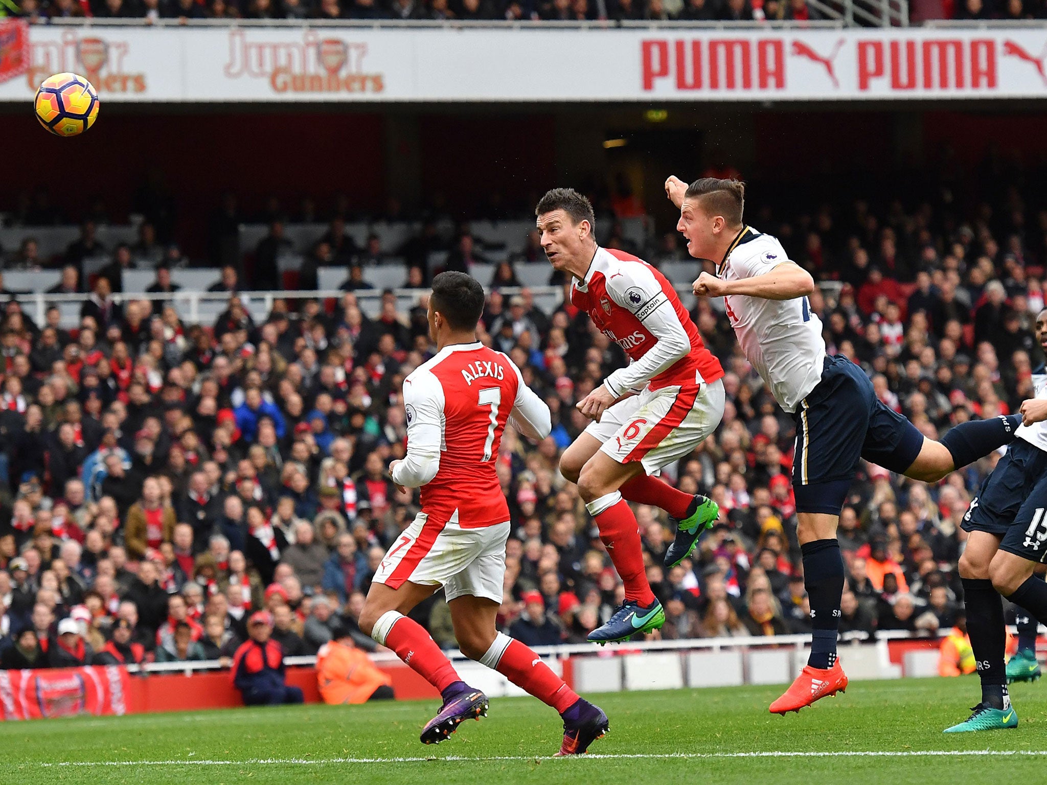 Kevin Wimmer accidentally heads the ball into his own net to hand Arsenal the lead