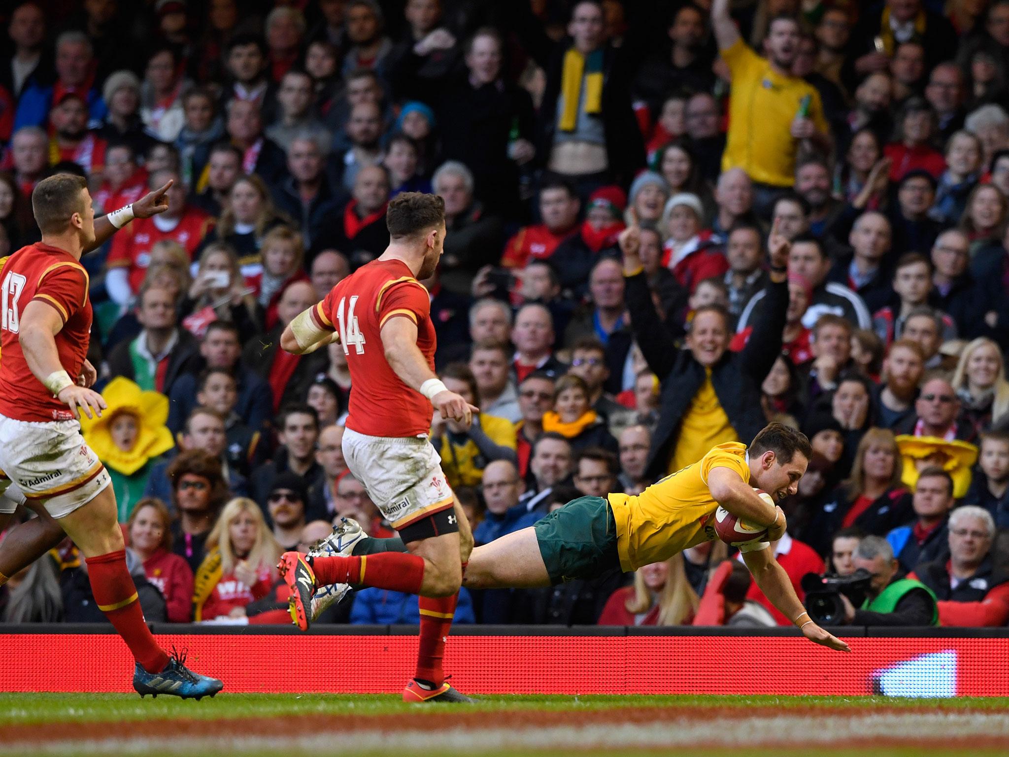 Bernard Foley ran in one of five Australia tries in Cardiff yesterday