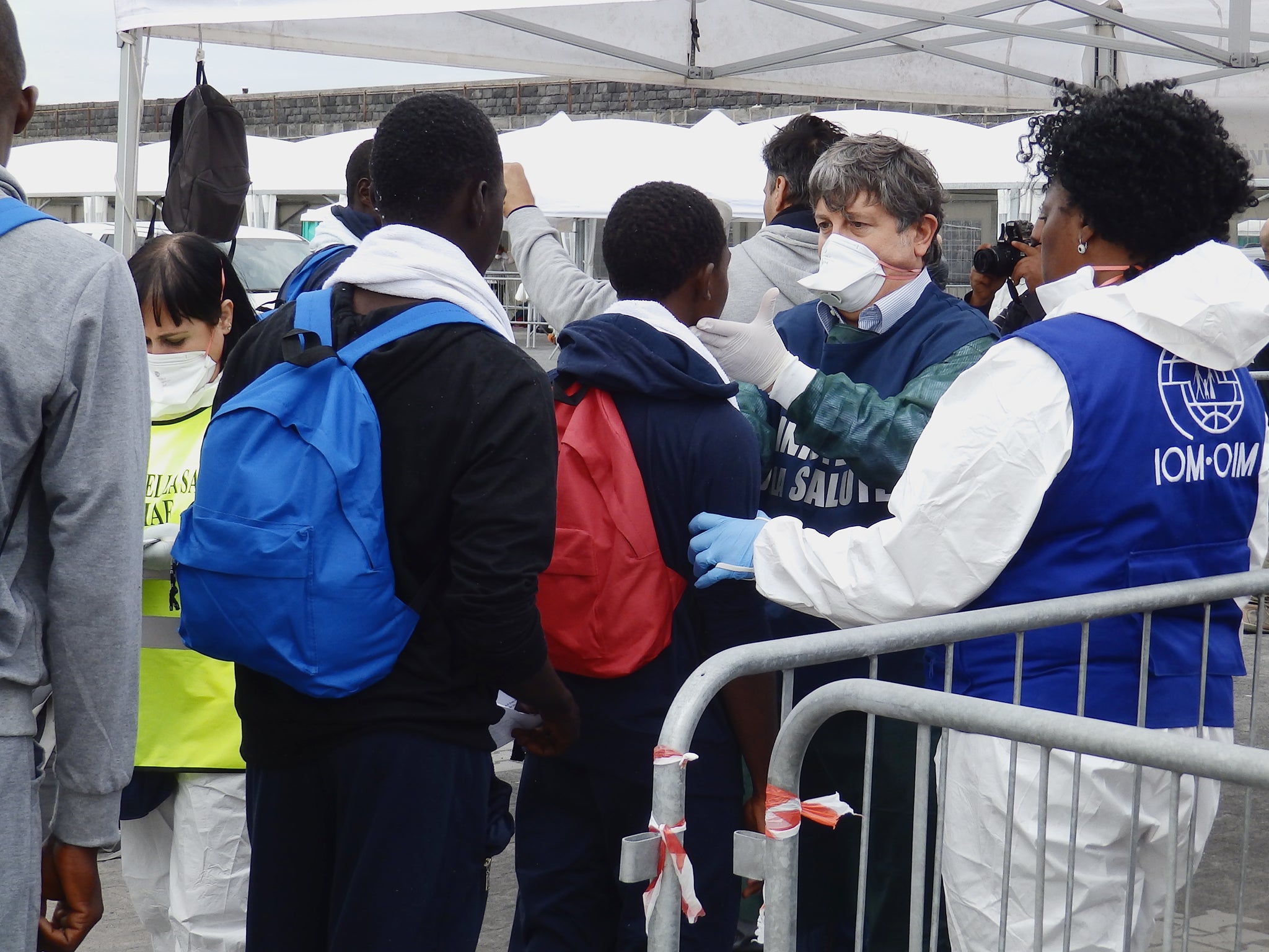 Refugees and migrants undergoing health checks after disembarking from MSF rescue ship the Bourbon Argos in Catania, Sicily