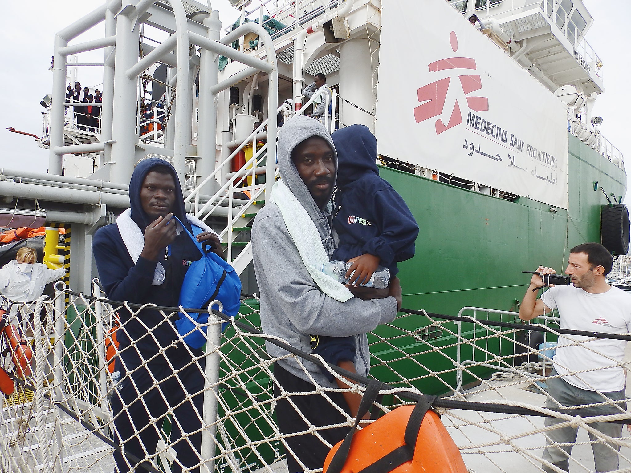 Refugees and migrants disembarking from MSF rescue ship the Bourbon Argos in Catania, Sicily