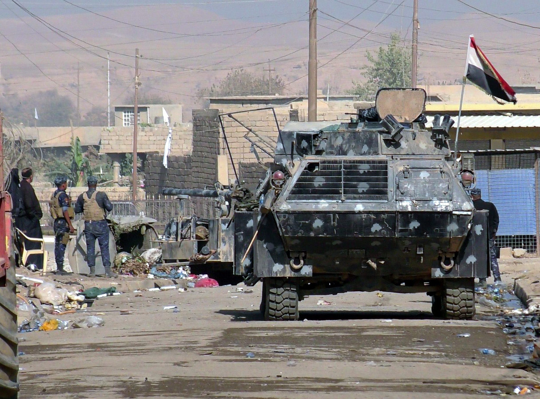 Iraqi Federal Police on patrol in Hammam Al-Alil town, south of Mosul, Iraq, 6 November 2016