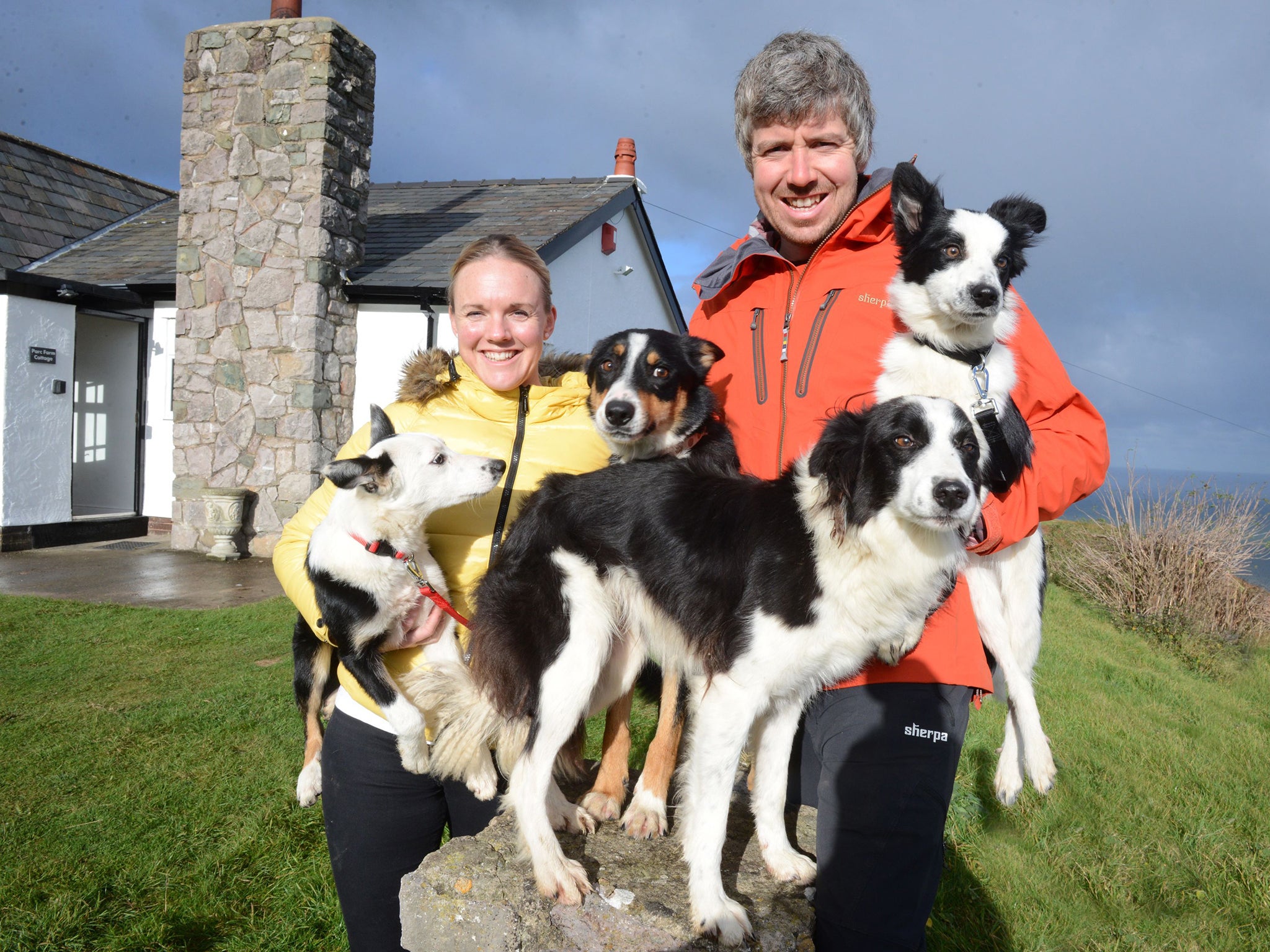 Shepherd Dan Jones with his wife Ceri and sheepdogs, who manage Parc Farm on the Great Orme, North Wales