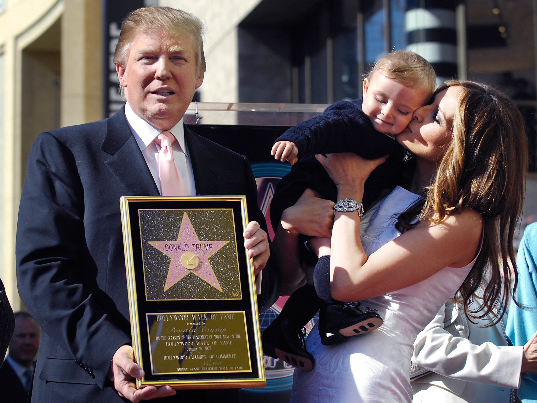 Donald Trump displays an image of his star on the Hollywood Walk of Fame