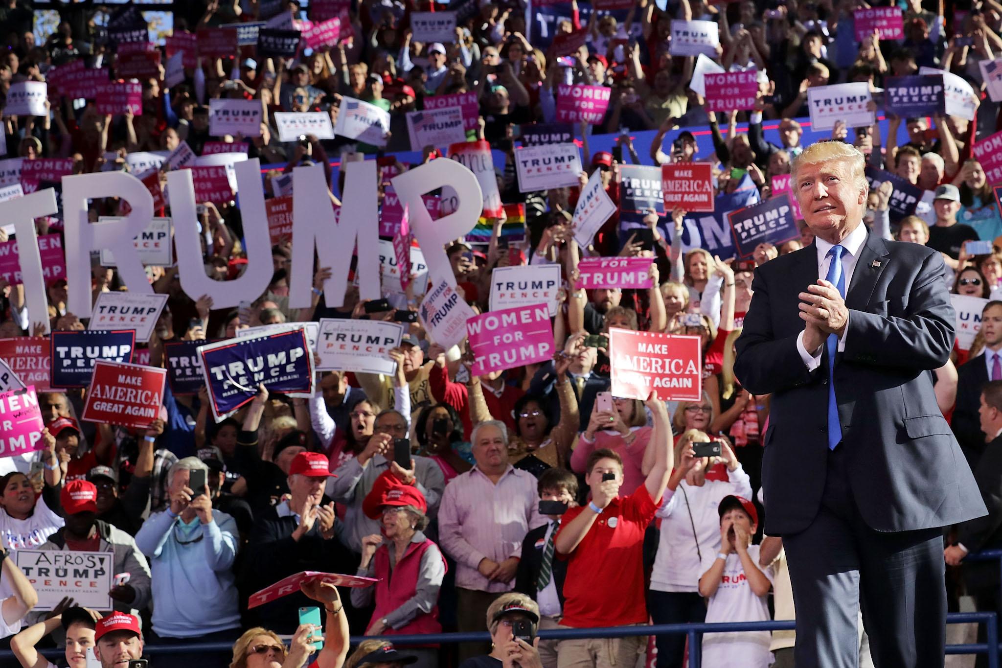 Republican presidential nominee Donald Trump takes the stage during a campaign rally at the J.S. Dorton Arena November 7, 2016 in Raleigh, North Carolina