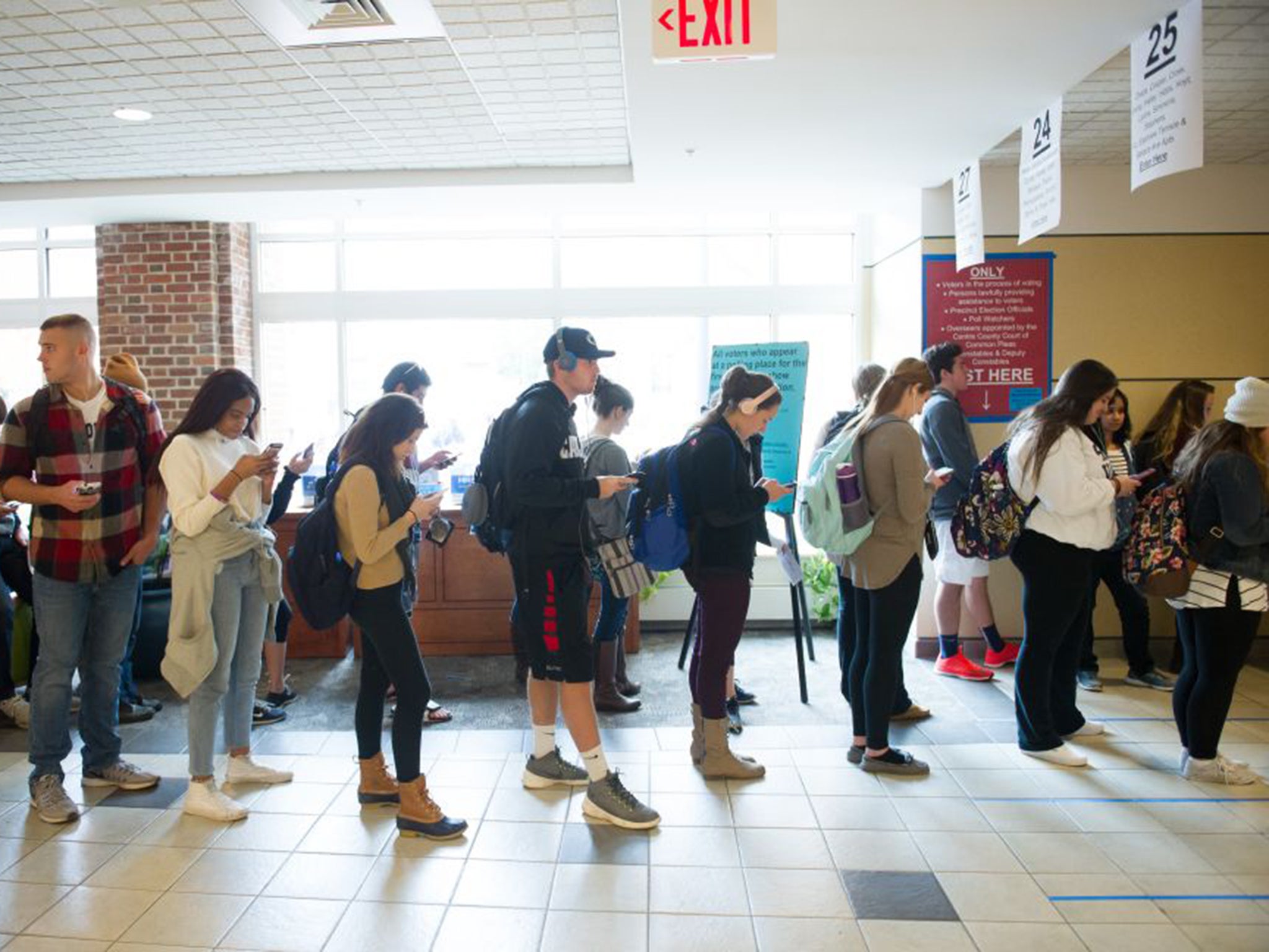 Students in Pennsylvania queue to cast their ballots - there were waiting times of 45 minutes to an hour during peak times