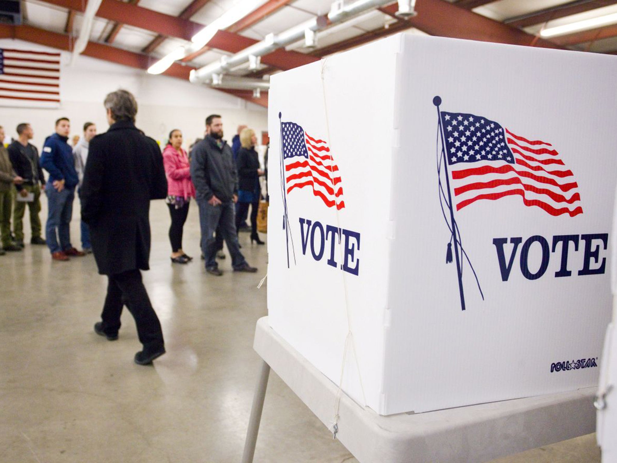 Voters line up by precinct to get their ballots at the Latah County Fairgrounds in Moscow, Idaho on Tuesday