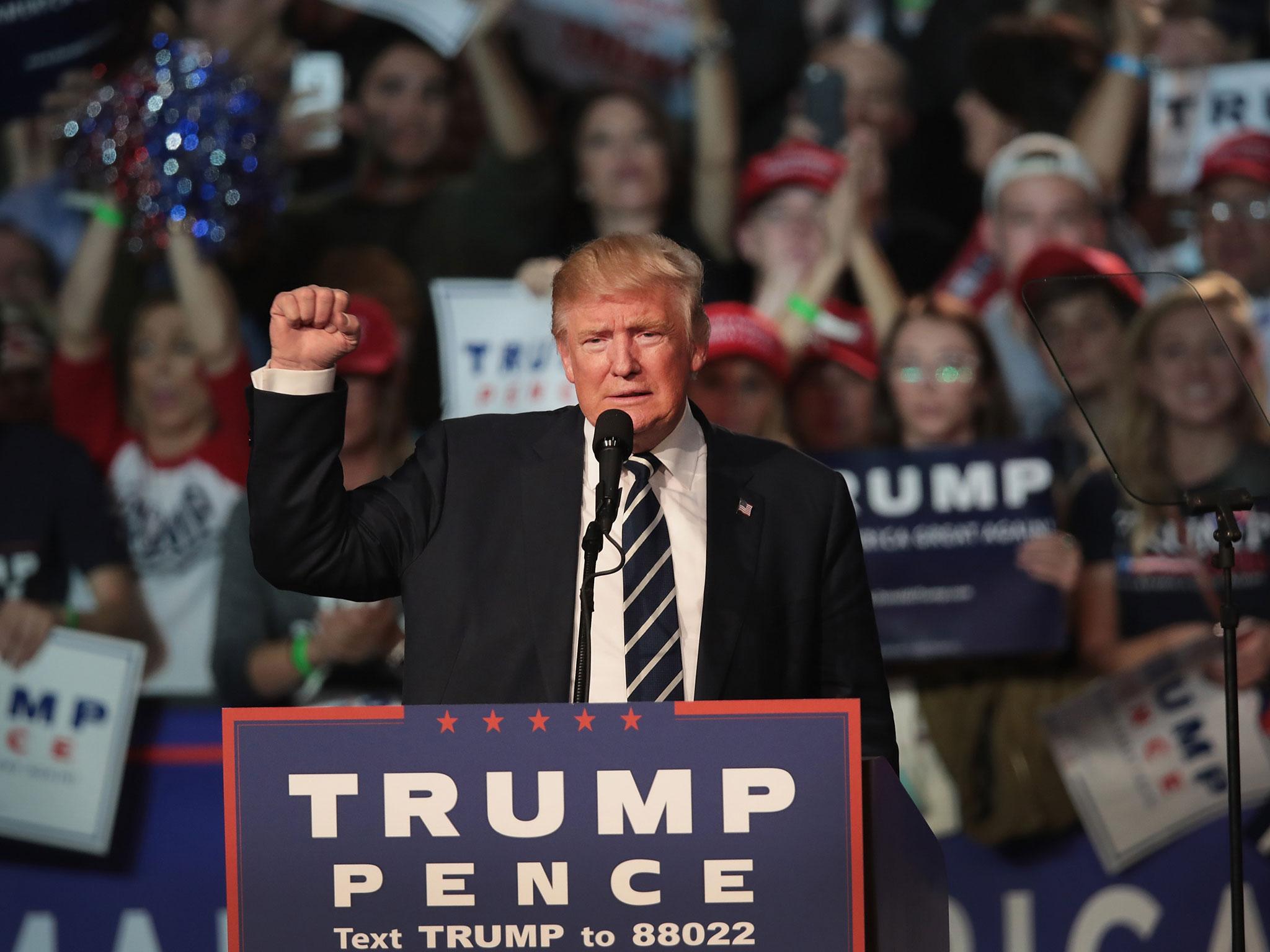 Republican presidential nominee Donald Trump addresses supporters during a campaign rally on 8 November, 2016 in Grand Rapids, Michigan