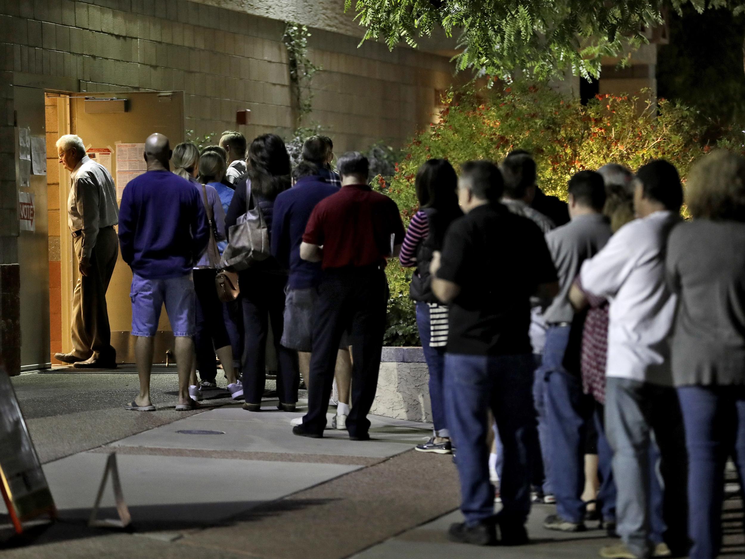 Voters in Phoenix, Arizona wait in line to vote early on election day