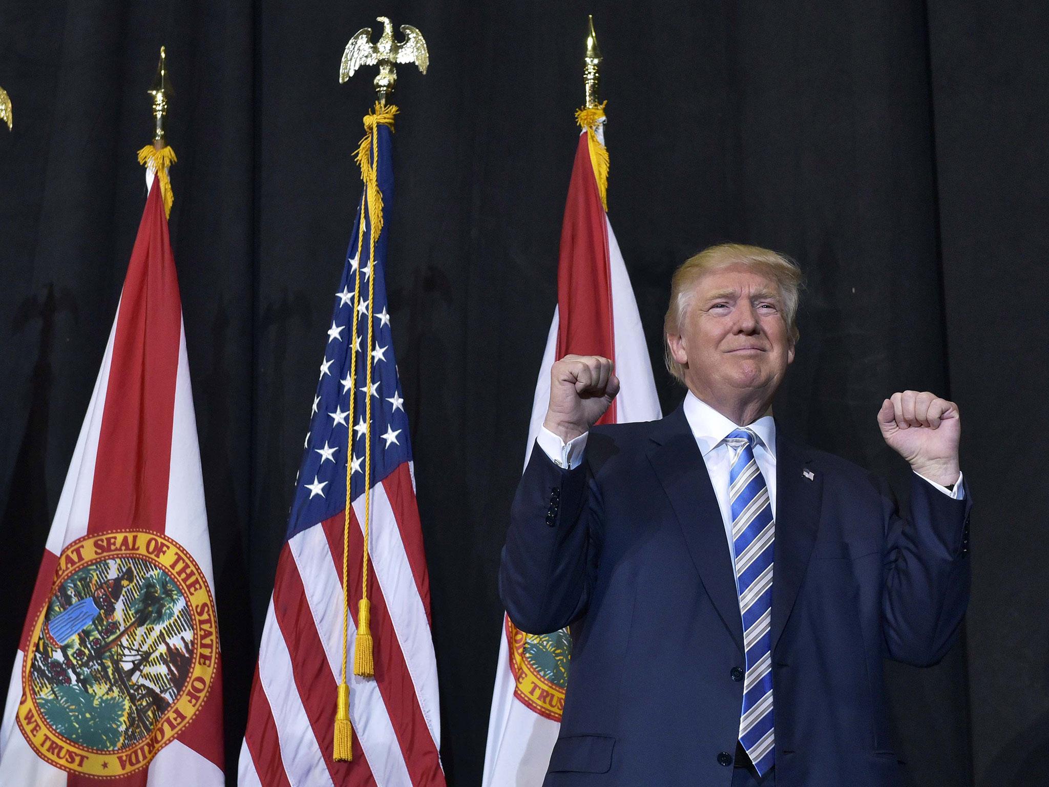 Republican presidential candidate Donald Trump addresses a campaign rally after midnight, early 7 November, 2016 at Loudoun Fairgrounds in Leesburg, Virginia