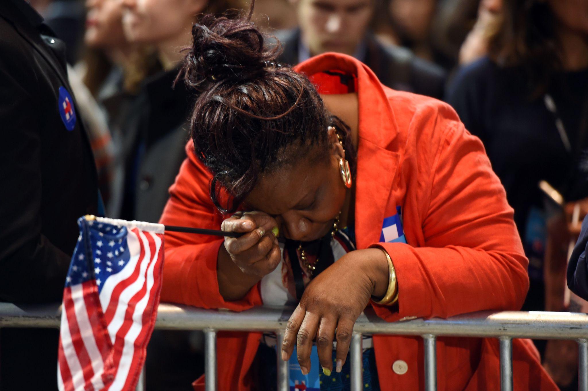 Marta Lunez, supporter of US Democratic presidential nominee Hillary Clinton, reacts to elections results during election night at the Jacob K. Javits Convention Center in New York on November 8, 2016