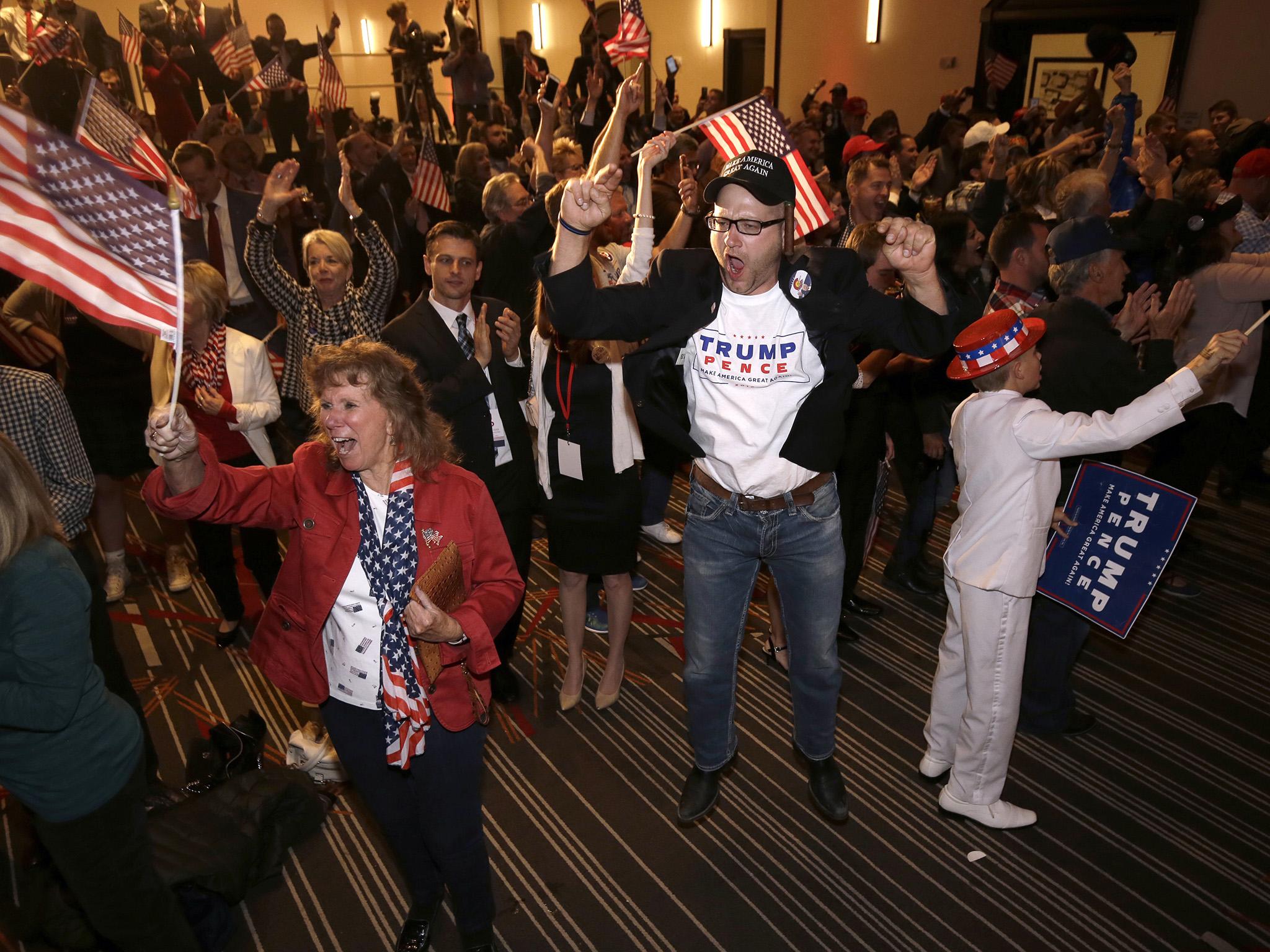 Jake Viano jumps in the air as President-elect Donald Trump gives his acceptance speech at the Colorado Republican election night party Wednesday, Nov. 9, 2016, in Greenwood Village, Colorado