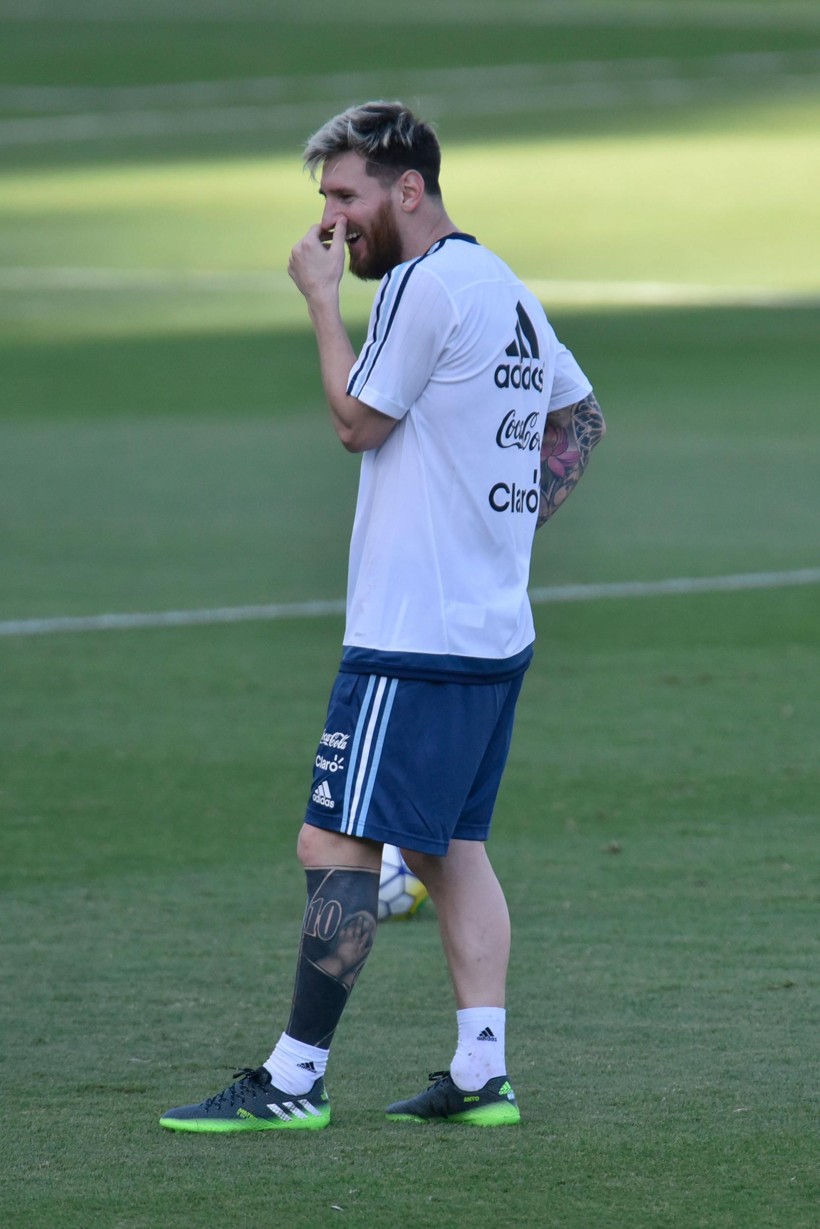 Messi shows off his new tattoo while training with the national team (Getty )