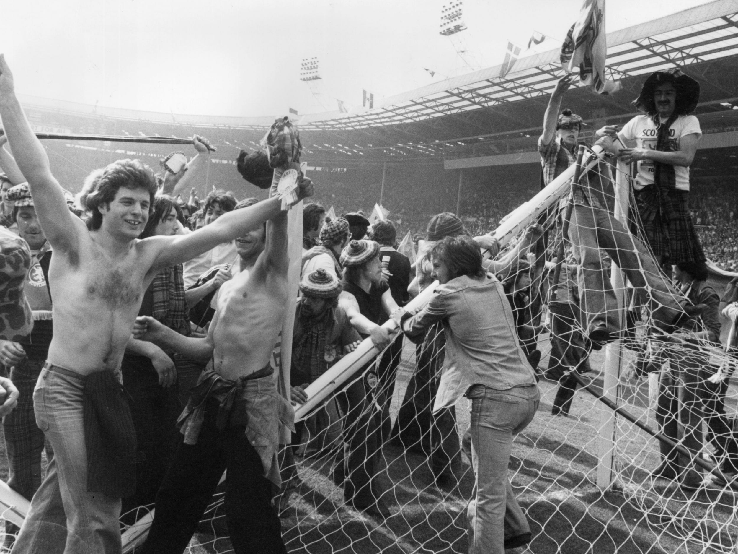 Scotland fans invade the Wembley pitch after the win