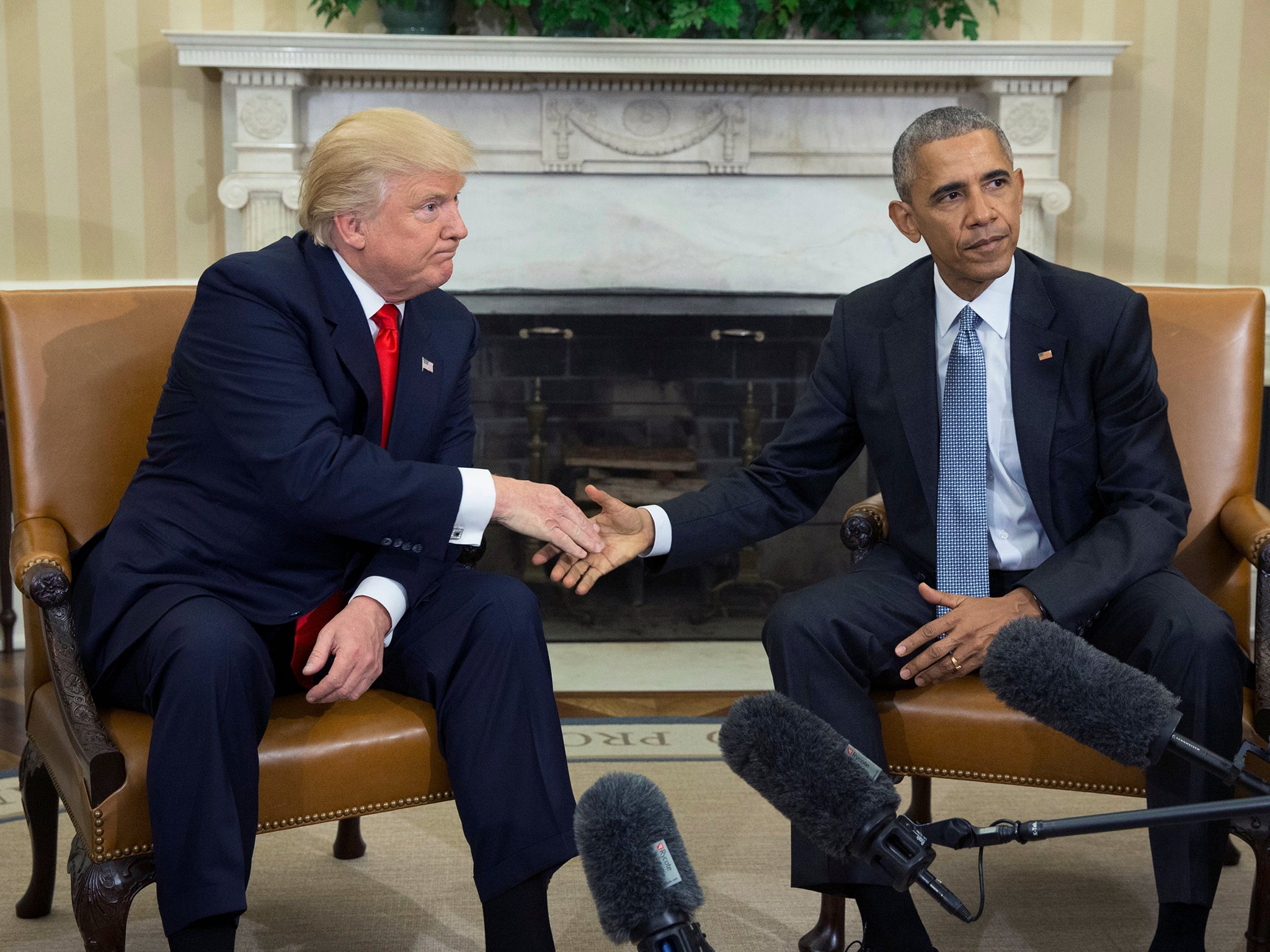 US President Barack Obama shakes hands with President-elect Donald Trump at the end of their meeting in the Oval Office of the White House in Washington, DC