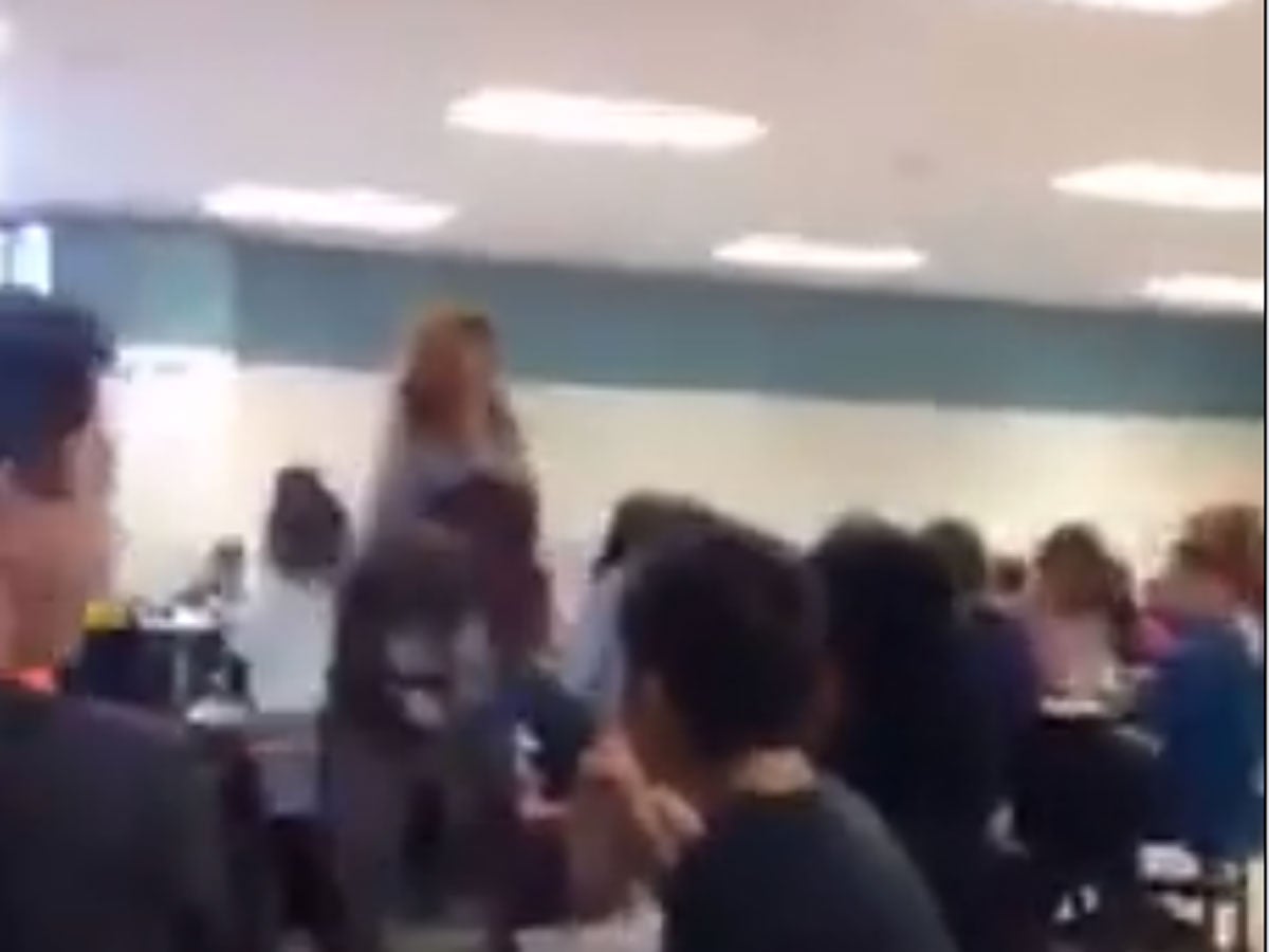 A still from the Facebook video showing a group of children chanting 'build that wall'