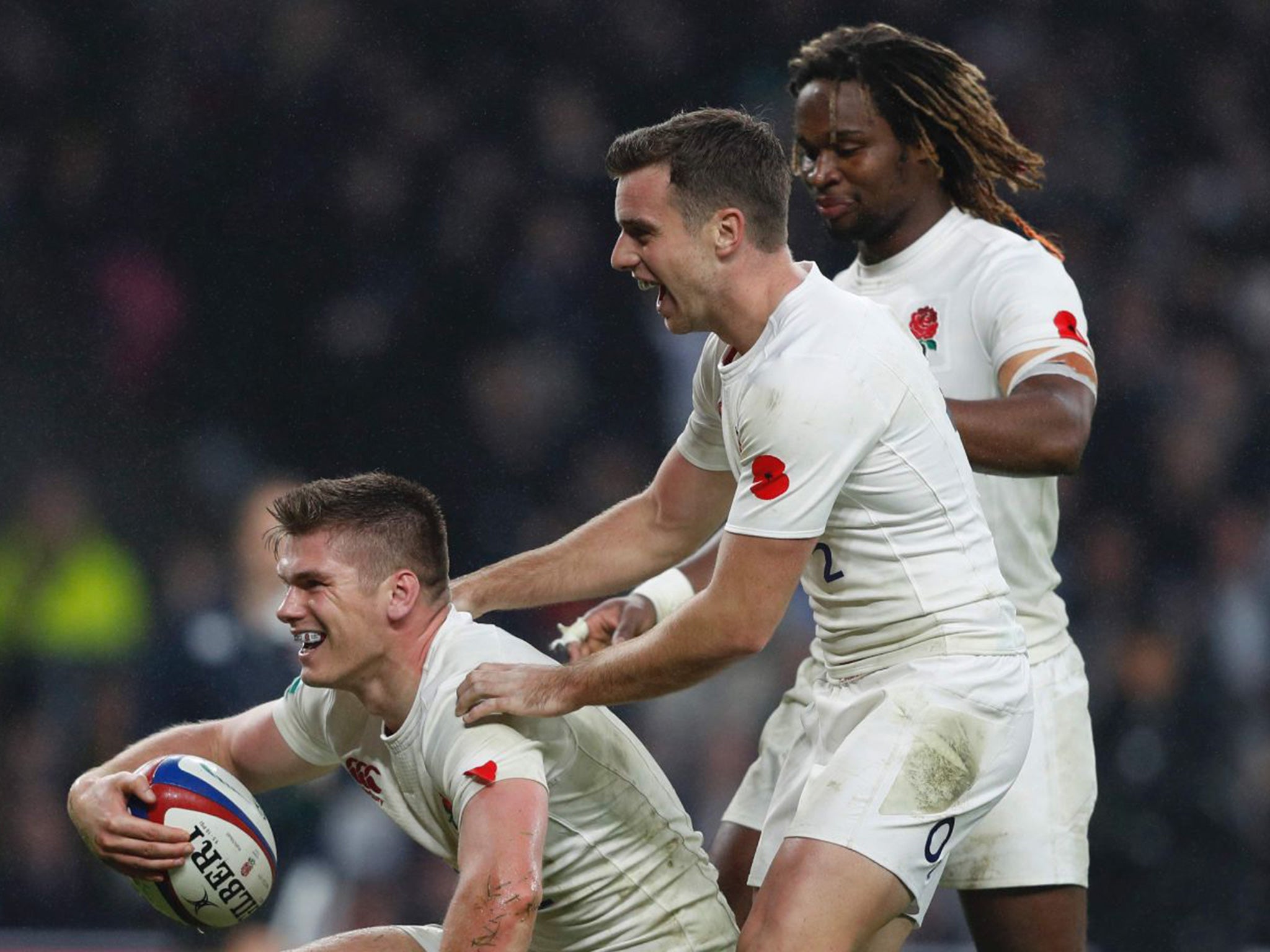 Farrell celebrates with Ford and Yarde after going over for England's fourth try