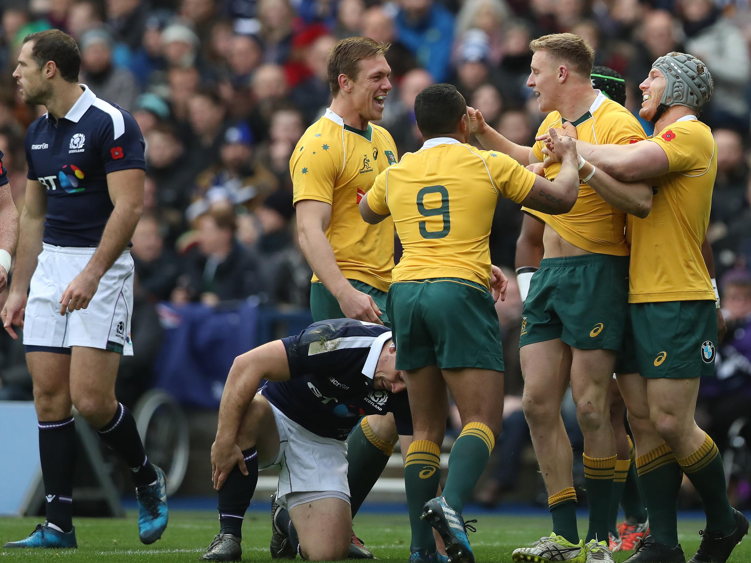 The Wallabies celebrate their first try