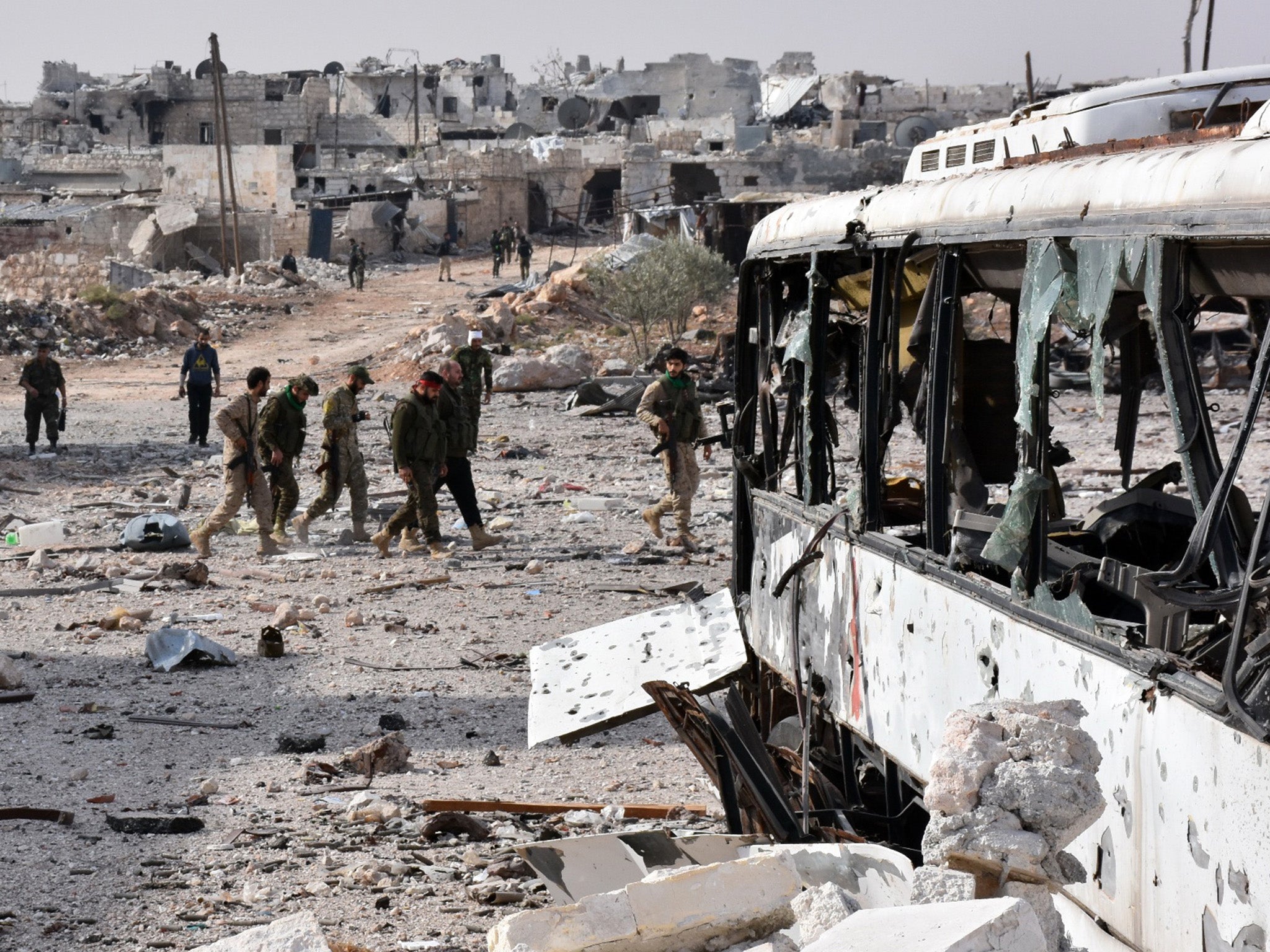 Syrian pro-government forces in the village of Minyan, west of Aleppo, after recapturing it from rebels in their failed attempt to break the siege on eastern neighbourhoods of the city