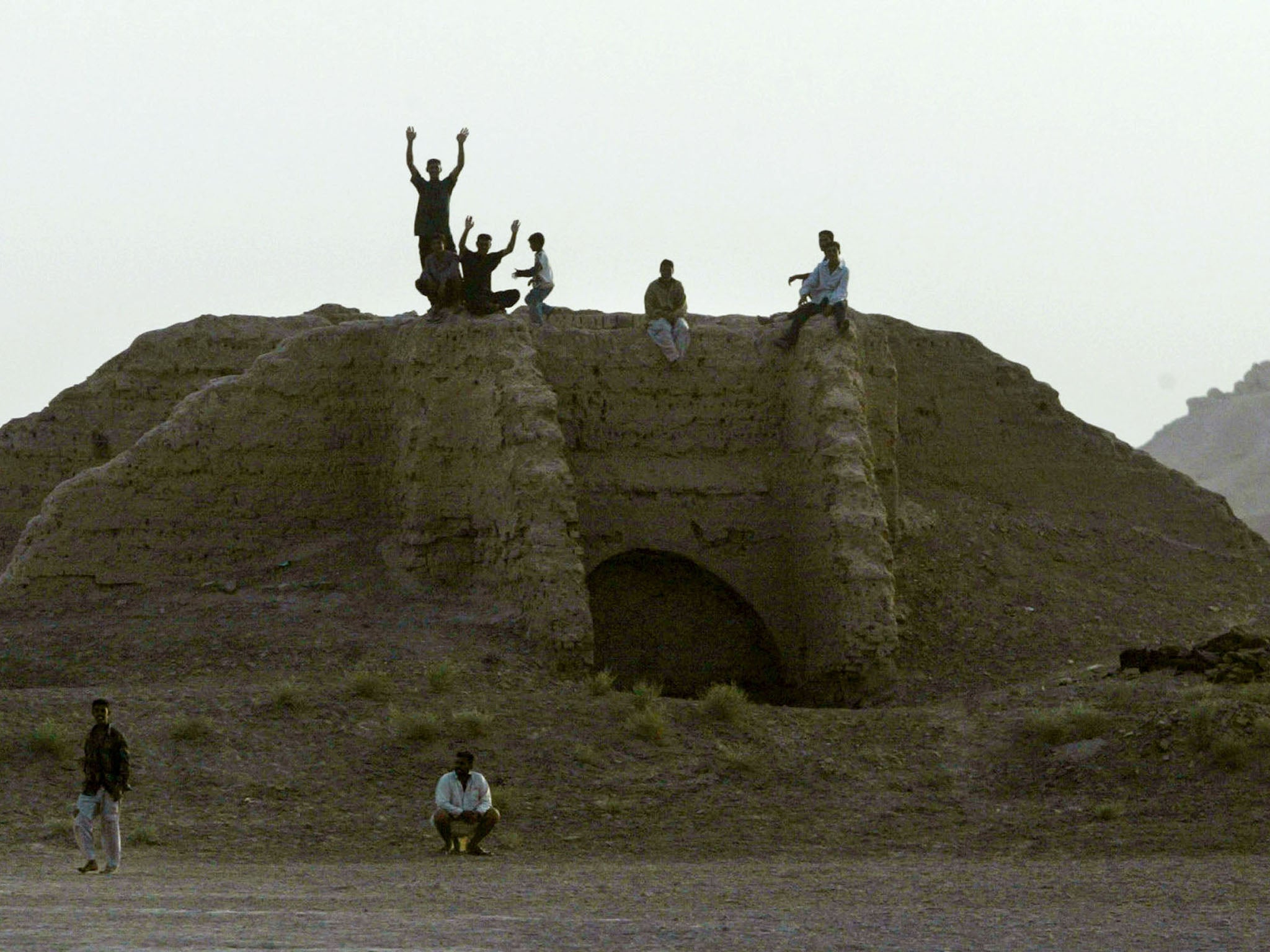 Young Iraqis on top of the ancient ruins of Nimrud in 2003. The city has been recaptured from Isis after 2 years (file photo)