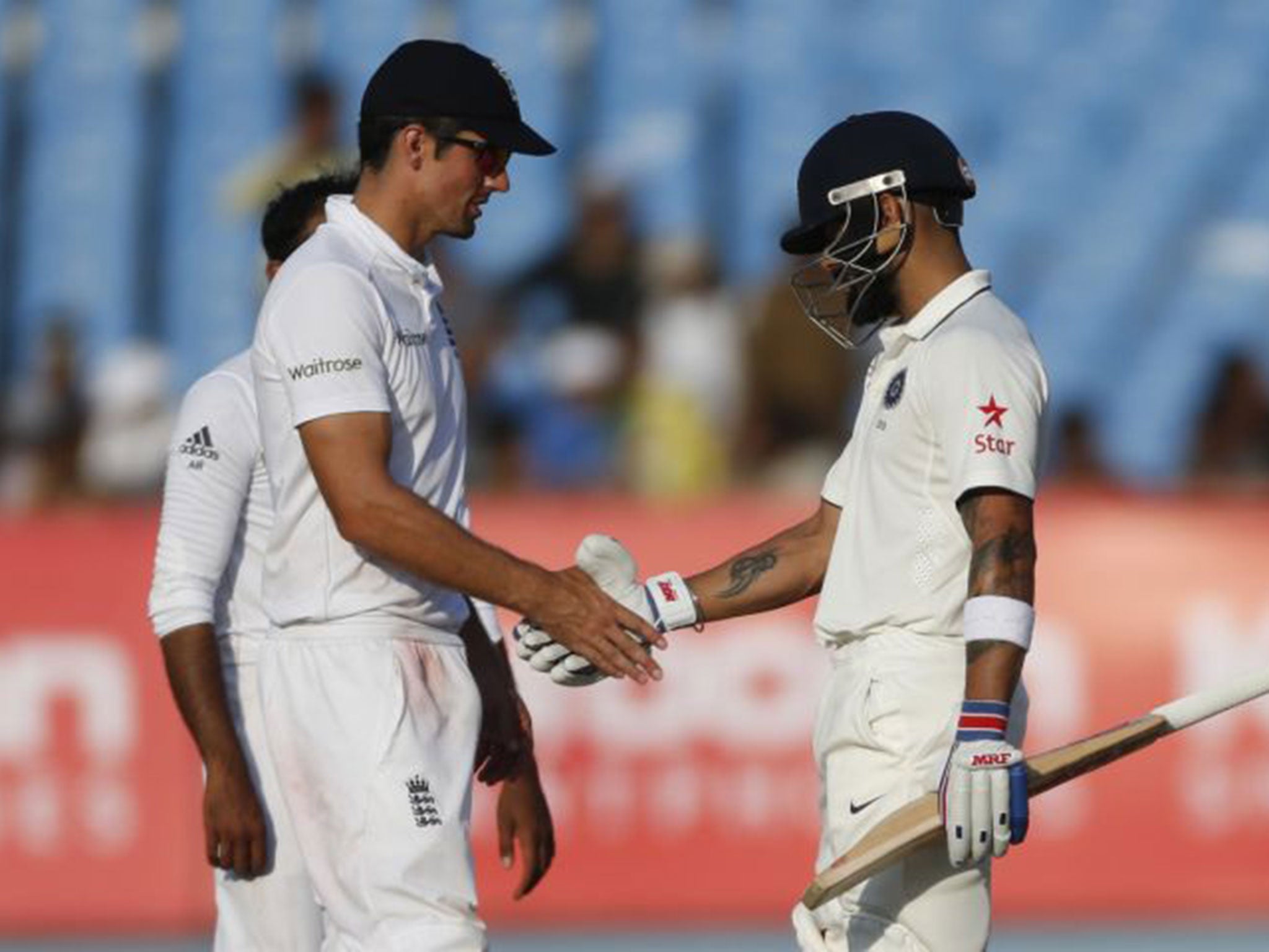 Alastair Cook shakes hands with Virat Kohli as the two captains settle on a draw in the first Test