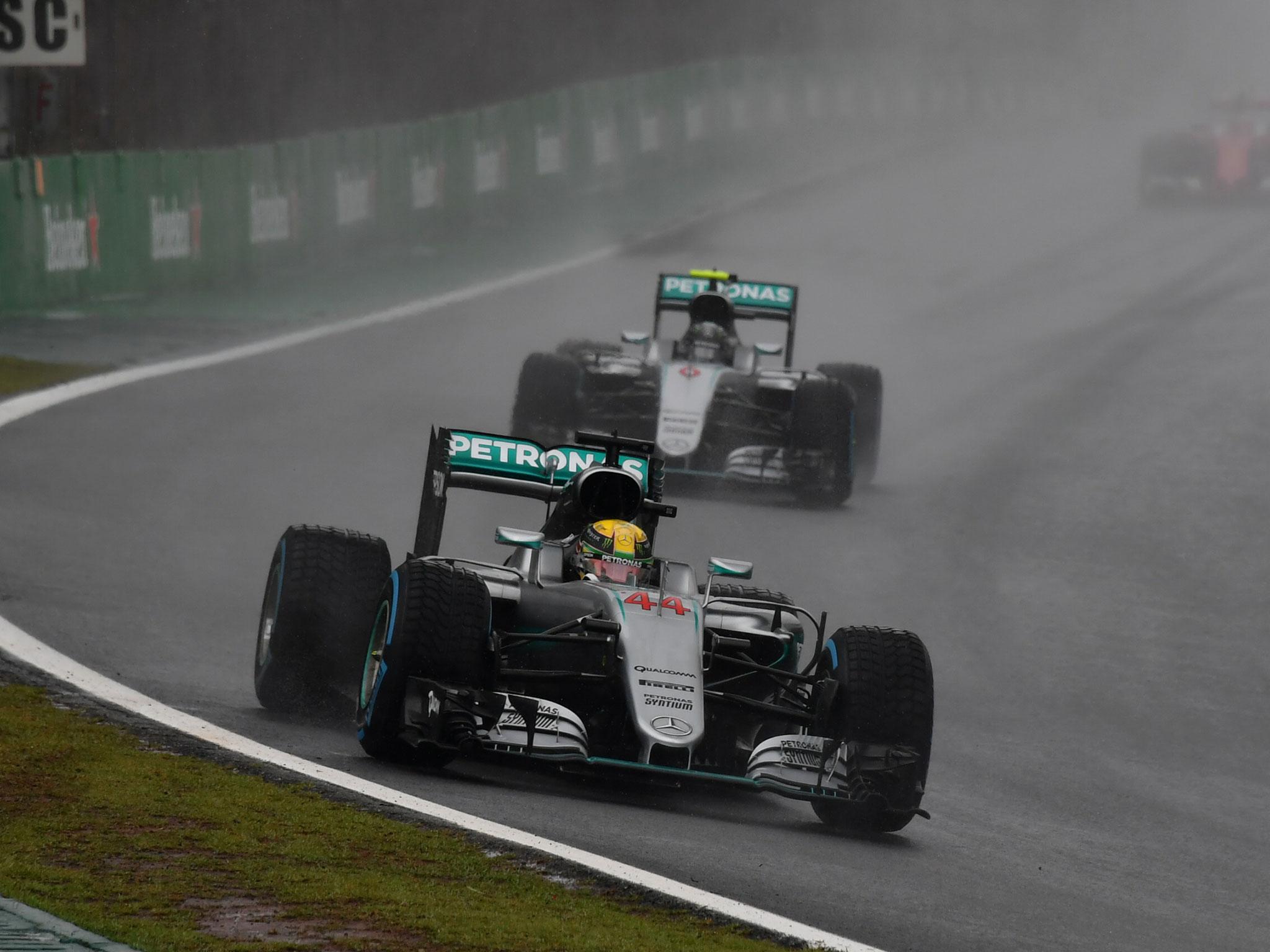 Lewis Hamilton heads the field behind the safety car