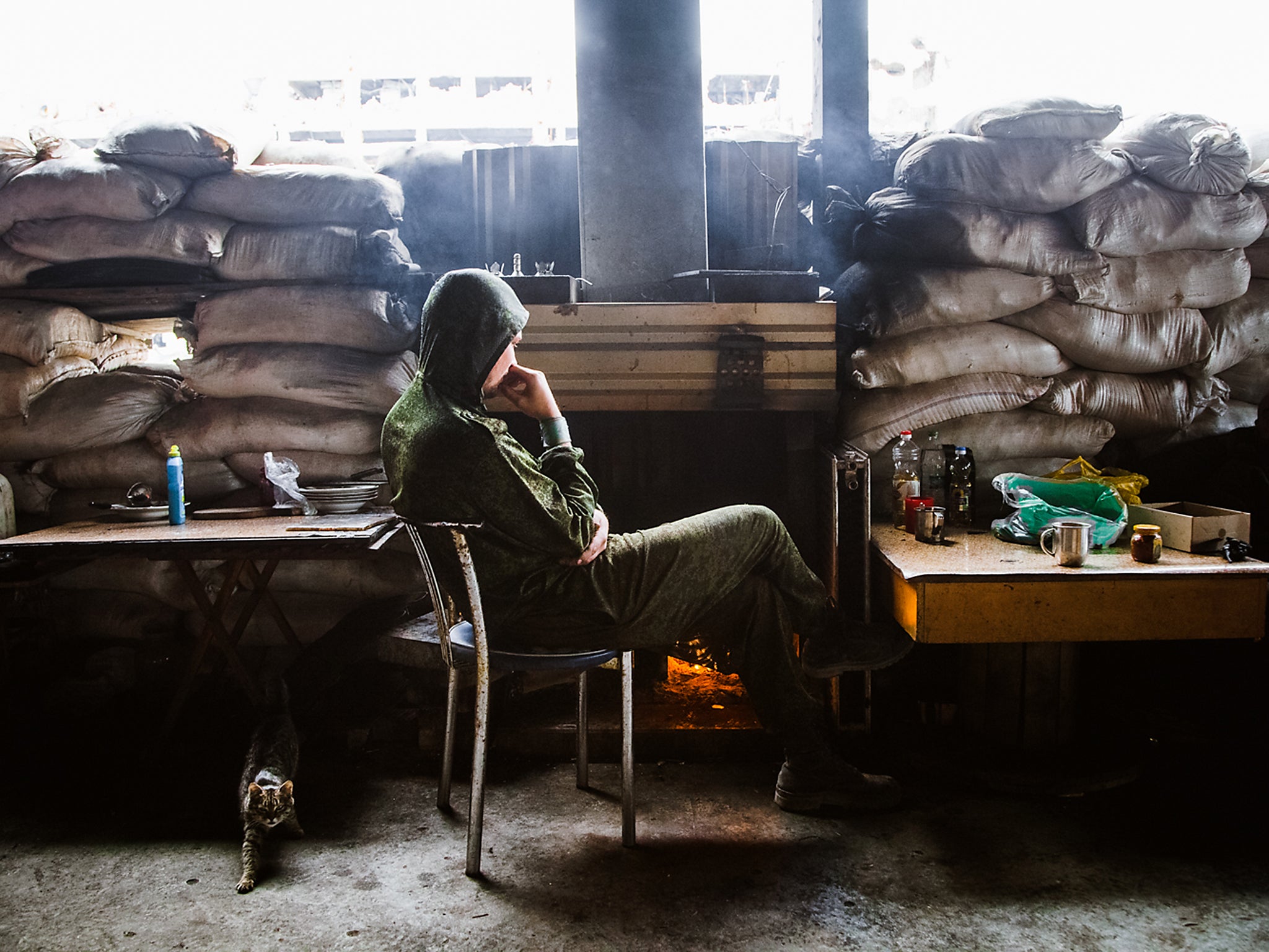 A soldier take a break from the conflict