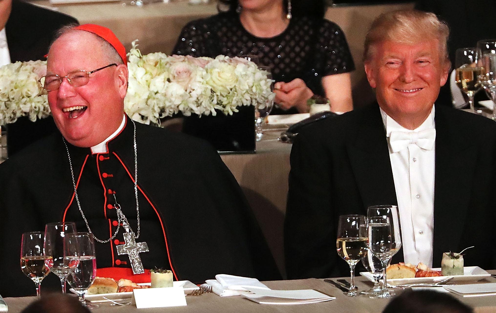 Cardinal Timothy Dolan sits next to Donald Trump at the annual Alfred E. Smith Memorial Foundation Dinner