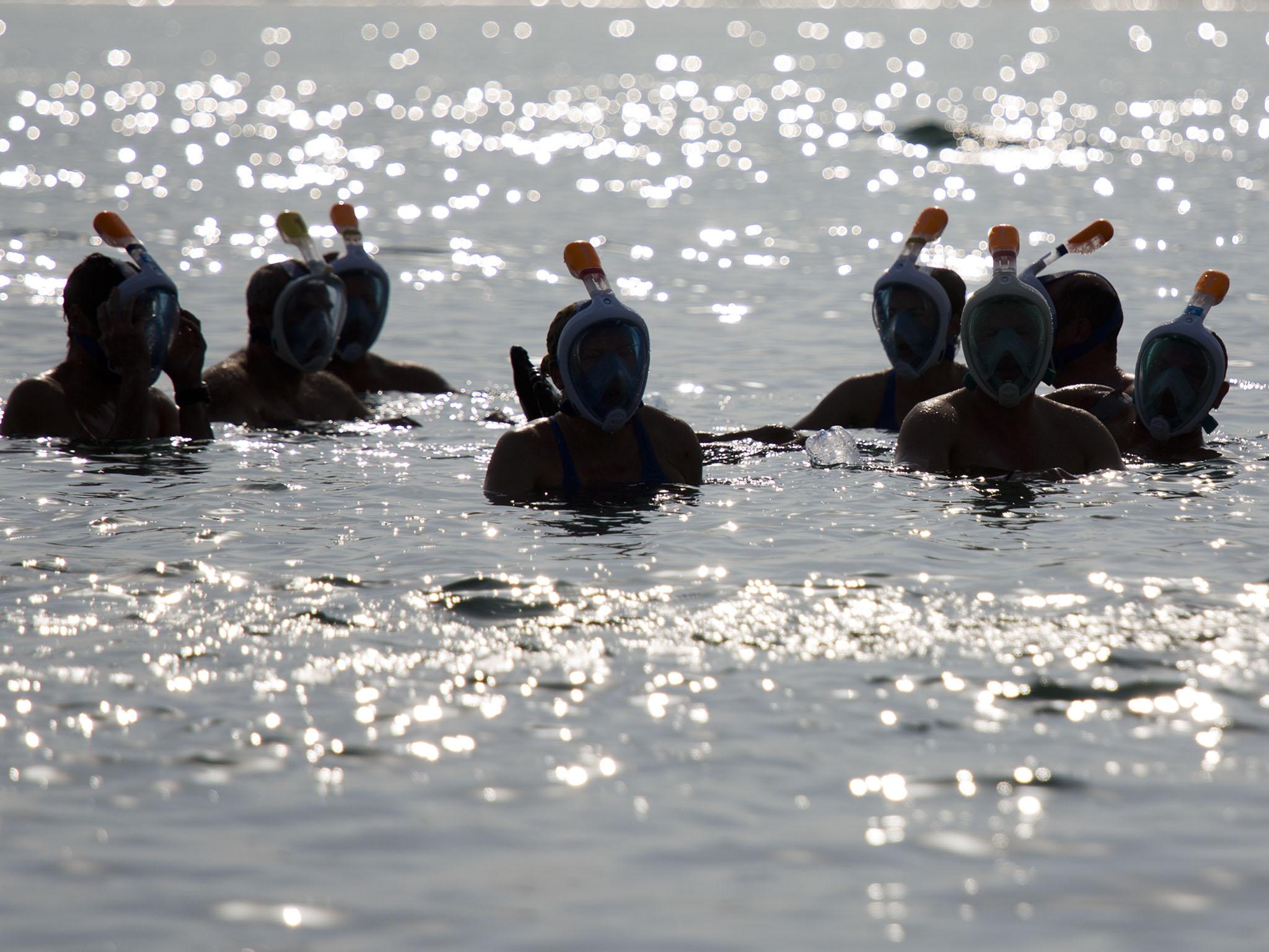 The swimmers were advised to wear protective masks to shield them from the corrosive salt