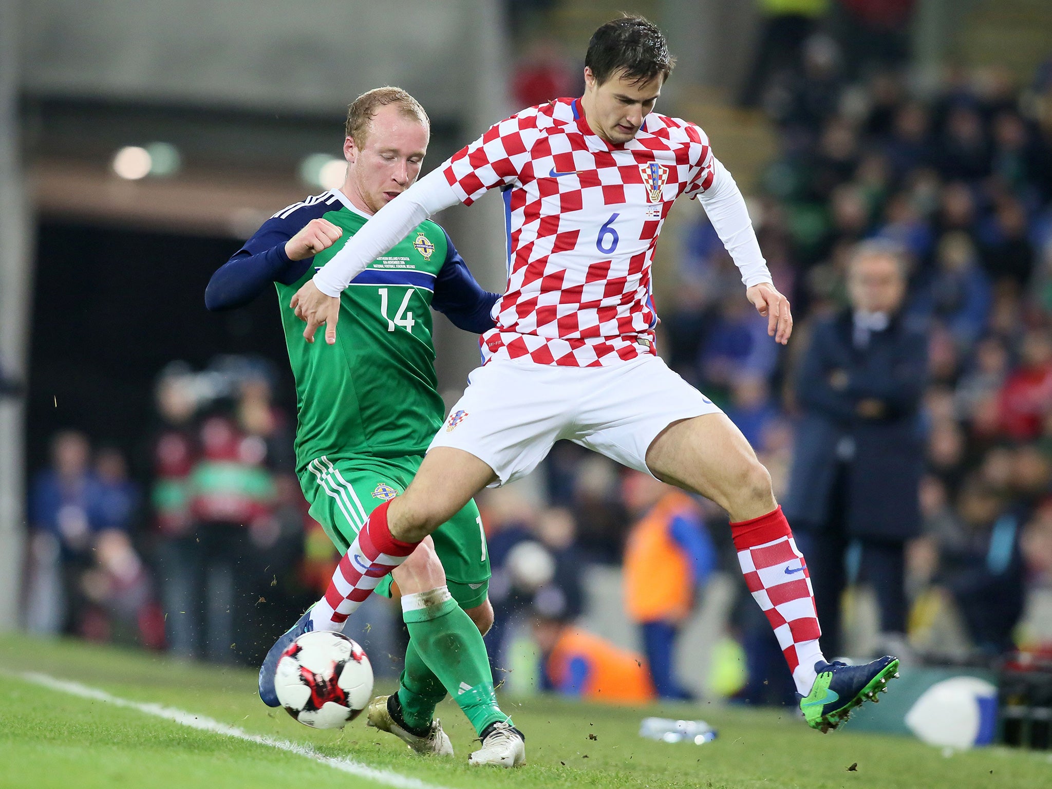 Boyce battles for the ball with Croatia's Mitrovic