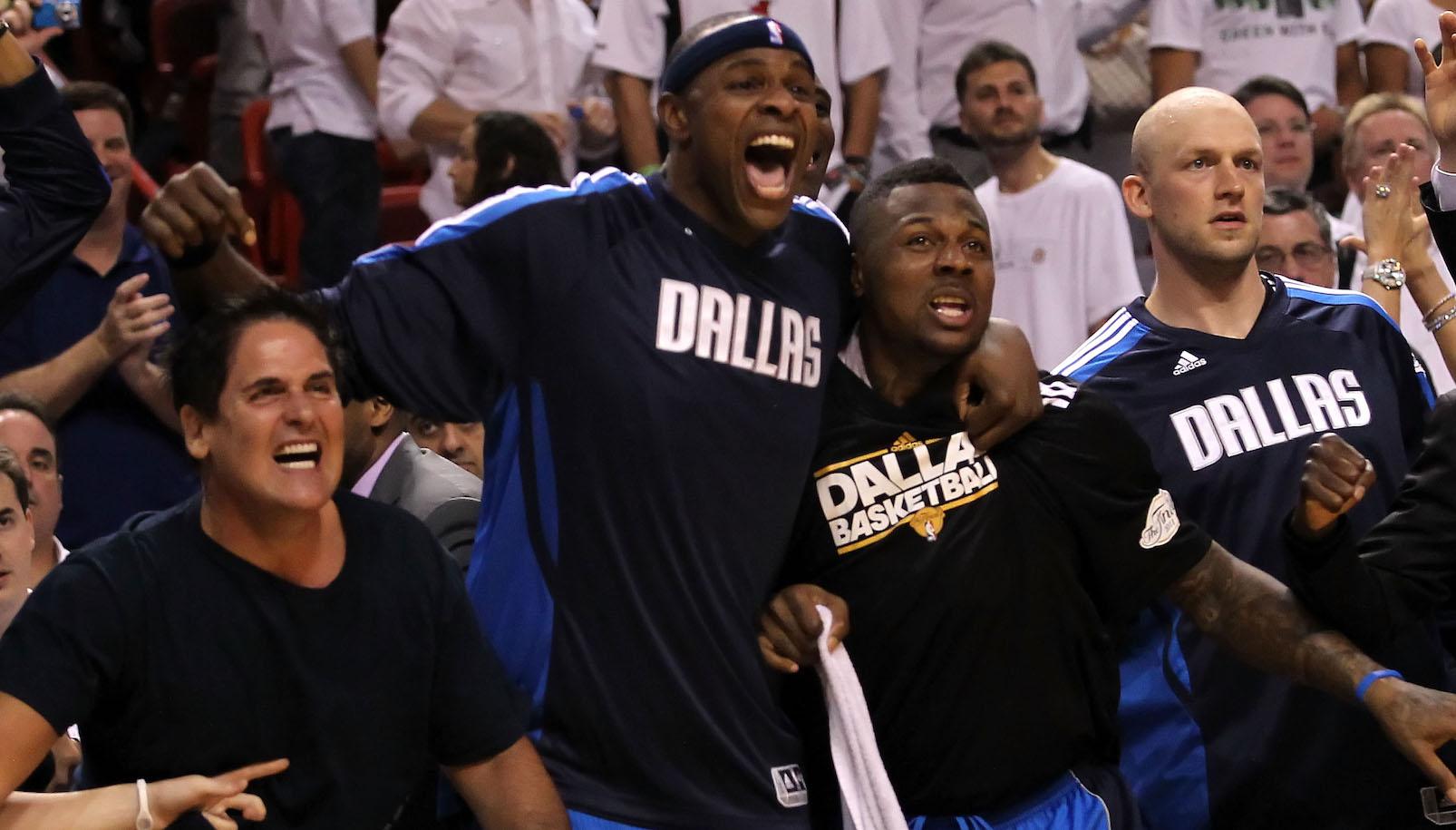 Owner Mark Cuban, Brendan Haywood #33 and DeShawn Stevenson #92 of the Dallas Mavericks react on the bench late in the fourth quarter while taking on the Miami Heat in Game Six of the 2011 NBA Finals at American Airlines Arena on June 12, 2011 in Miami, Florida.