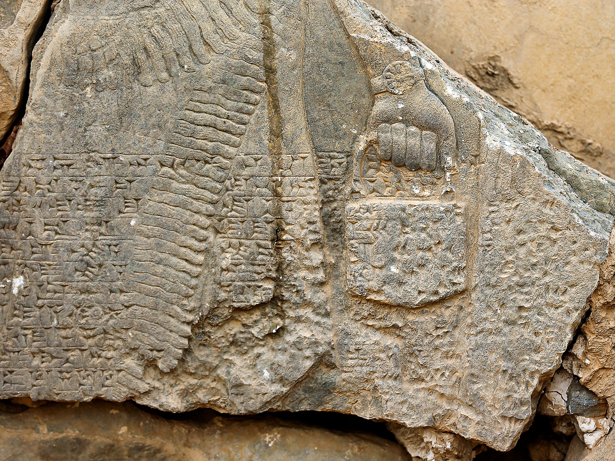 Part of carved stone slabs destroyed by Islamic State militants seen at the ancient site of Nimrud some 19 miles south east of Mosul, Iraq