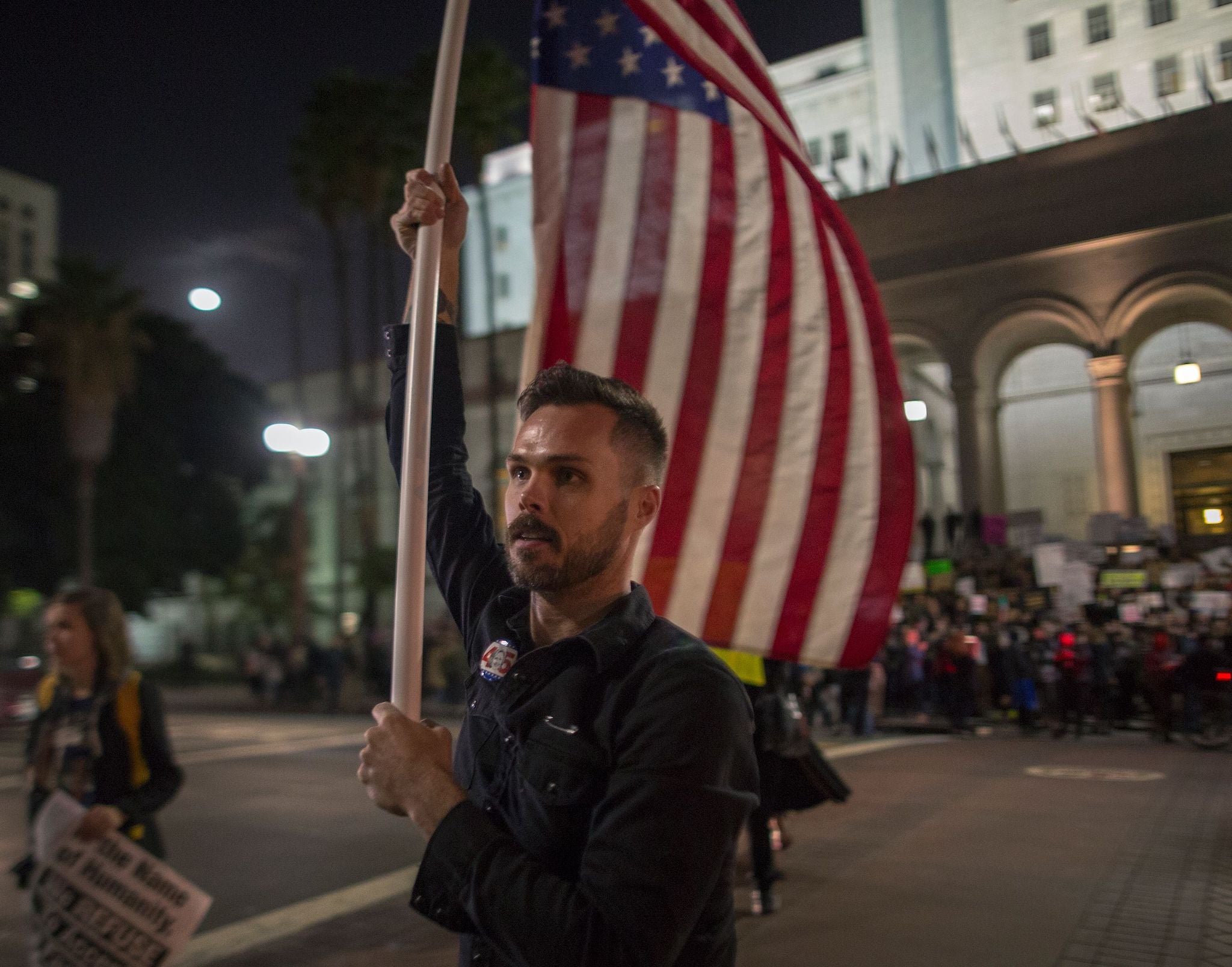 People stage a protest against President-elect Donald Trump on 16 November, near City Hall in Los Angeles, California