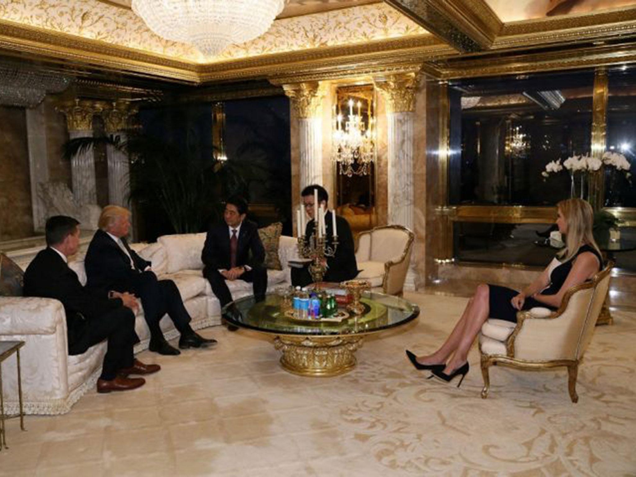 Japan's Prime Minister Shinzo Abe meets with US President-elect Donald Trump and his daughter, Ivanka at Trump Tower in Manhattan, New York